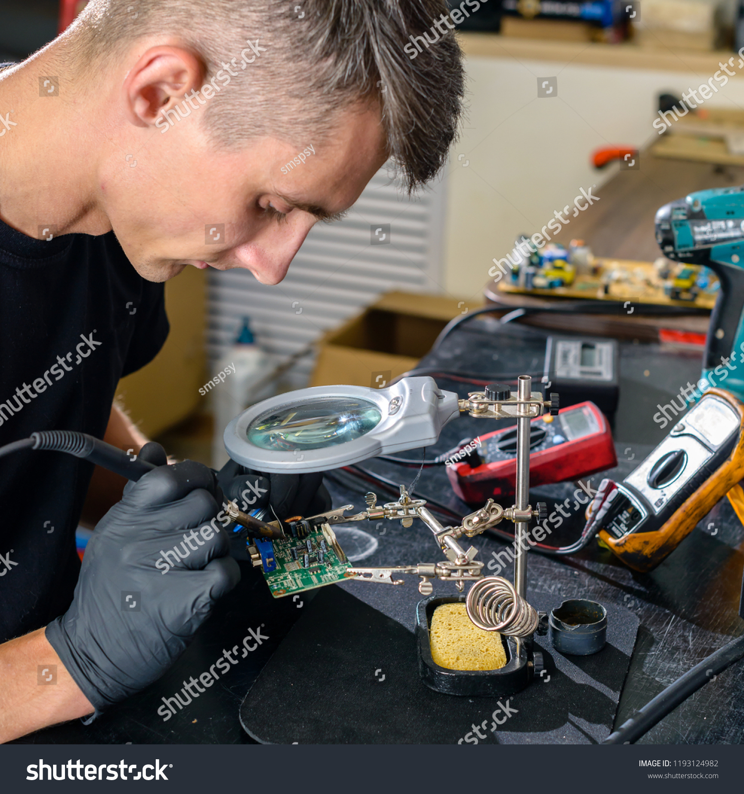 Close up. Men Repairing Hardware Equipment in Workshop. Repair Shop #1193124982