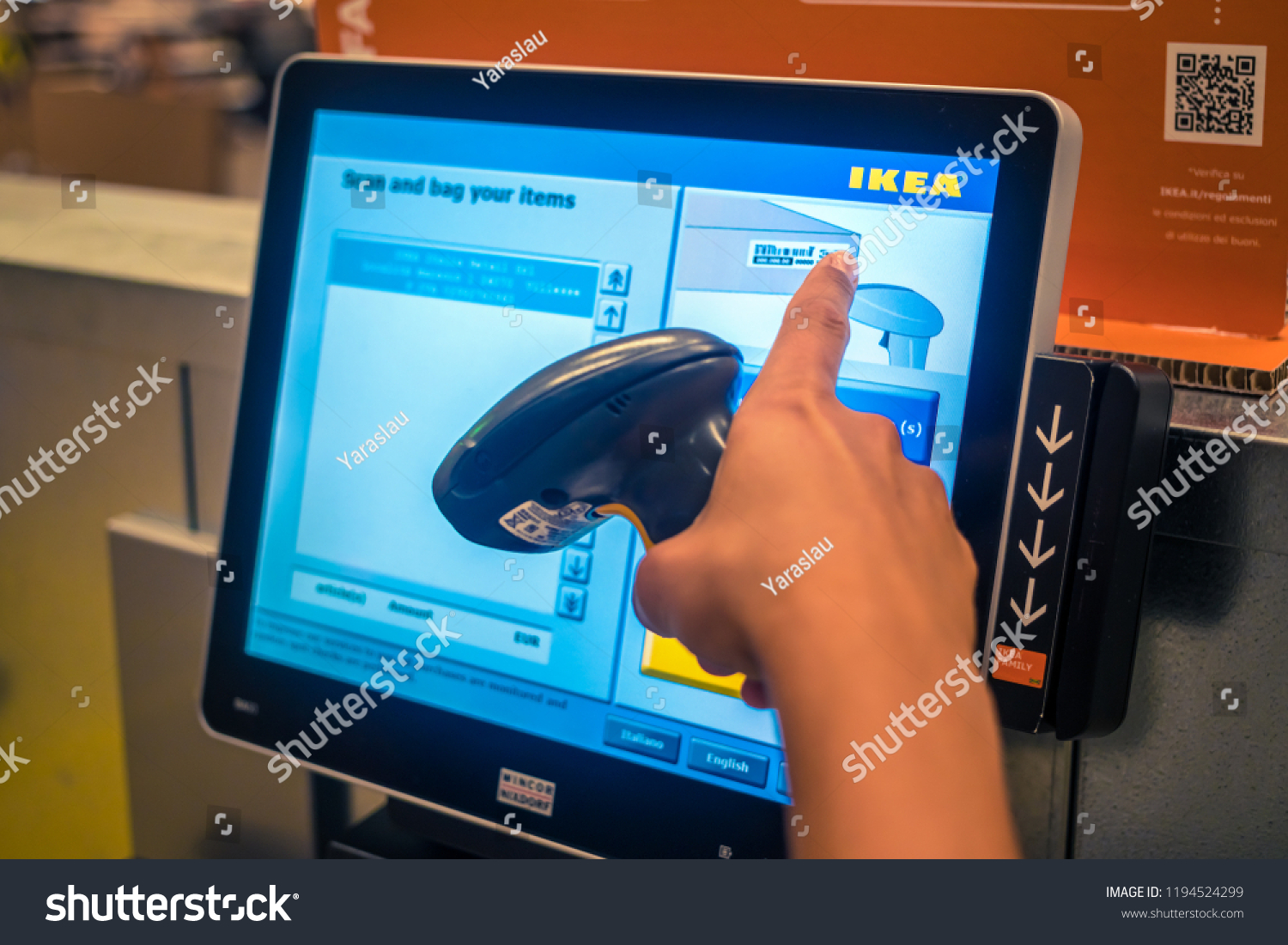 Gorizia, Italy, August 11, 2018: Ikea store, self-service scanner at the cash register, finger points to the price #1194524299