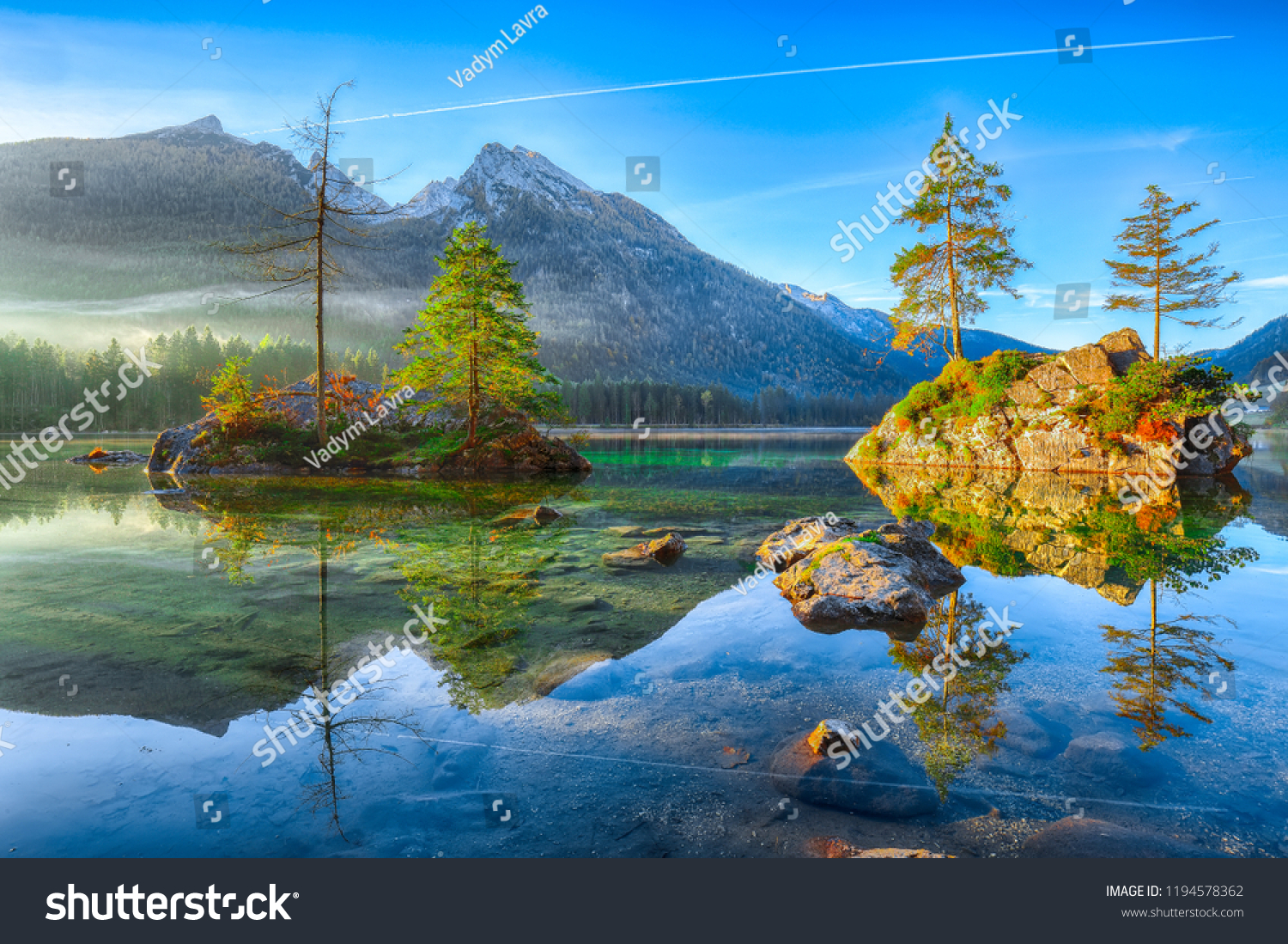 Fantastic autumn sunrise of Hintersee lake. Beautiful scene of trees on a rock island. Location: resort Ramsau, National park Berchtesgadener Land, Upper Bavaria, Germany Alps, Europe #1194578362
