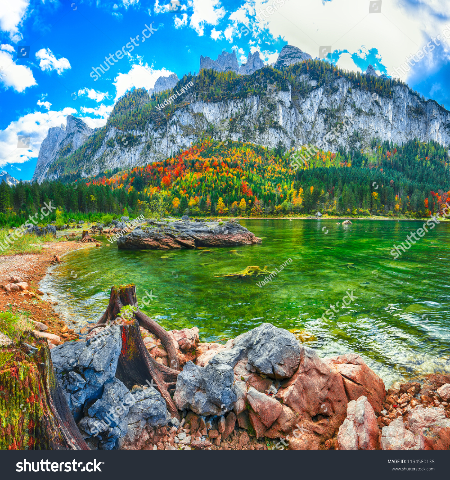 Beautiful view of idyllic colorful autumn scenery with Dachstein mountain summit by Gosausee mountain lake in fall Salzkammergut region Upper Austria Austria #1194580138