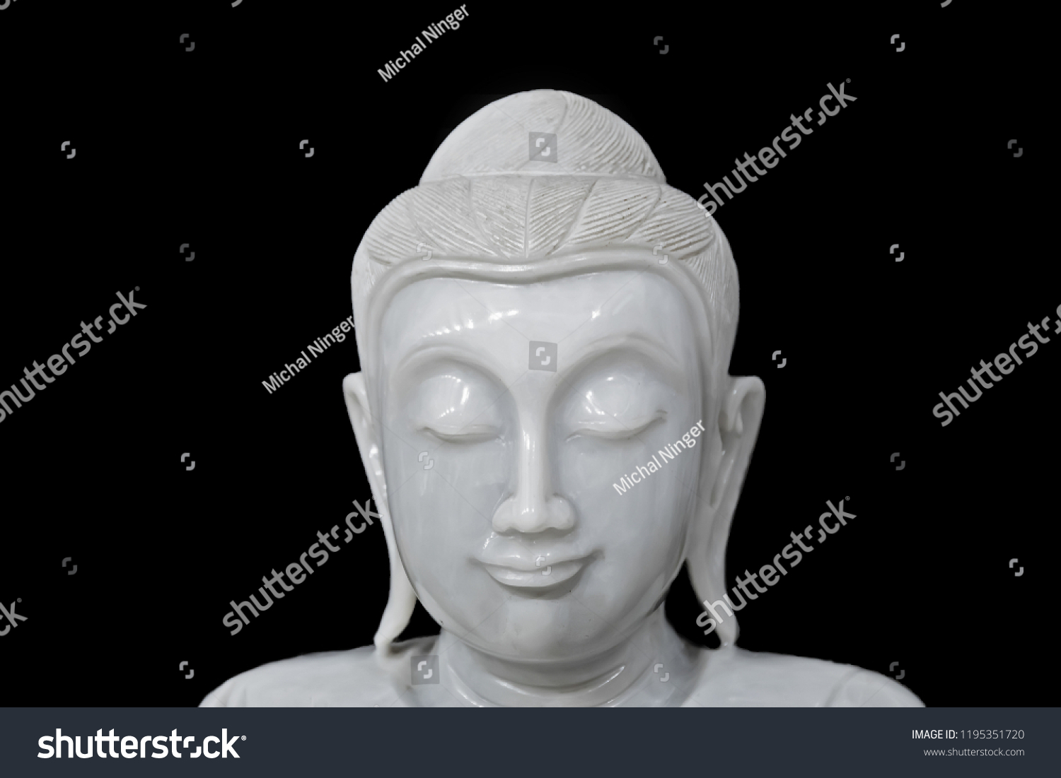 statue of Buddha detail face with black background #1195351720