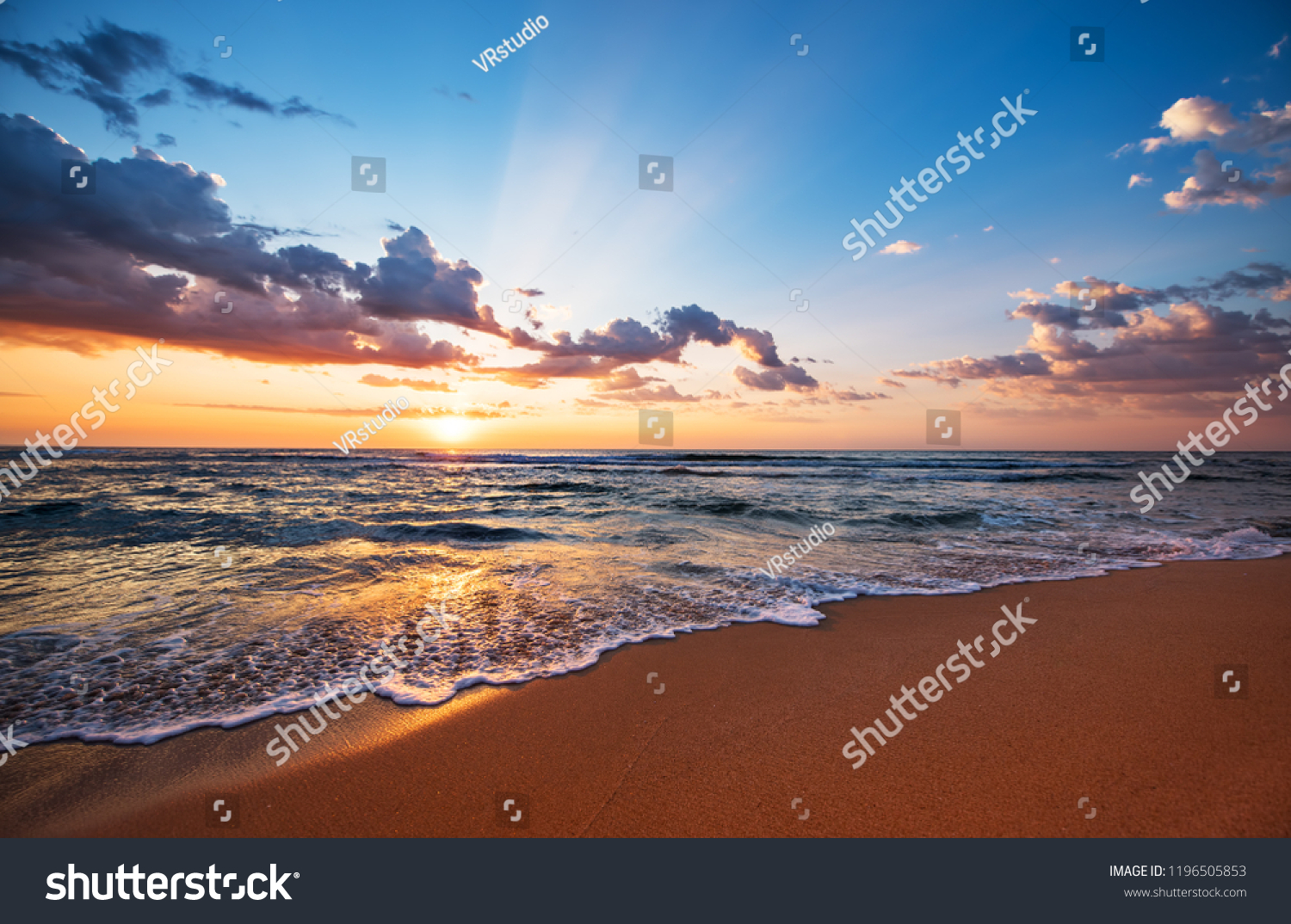 Colorful ocean beach sunrise. #1196505853