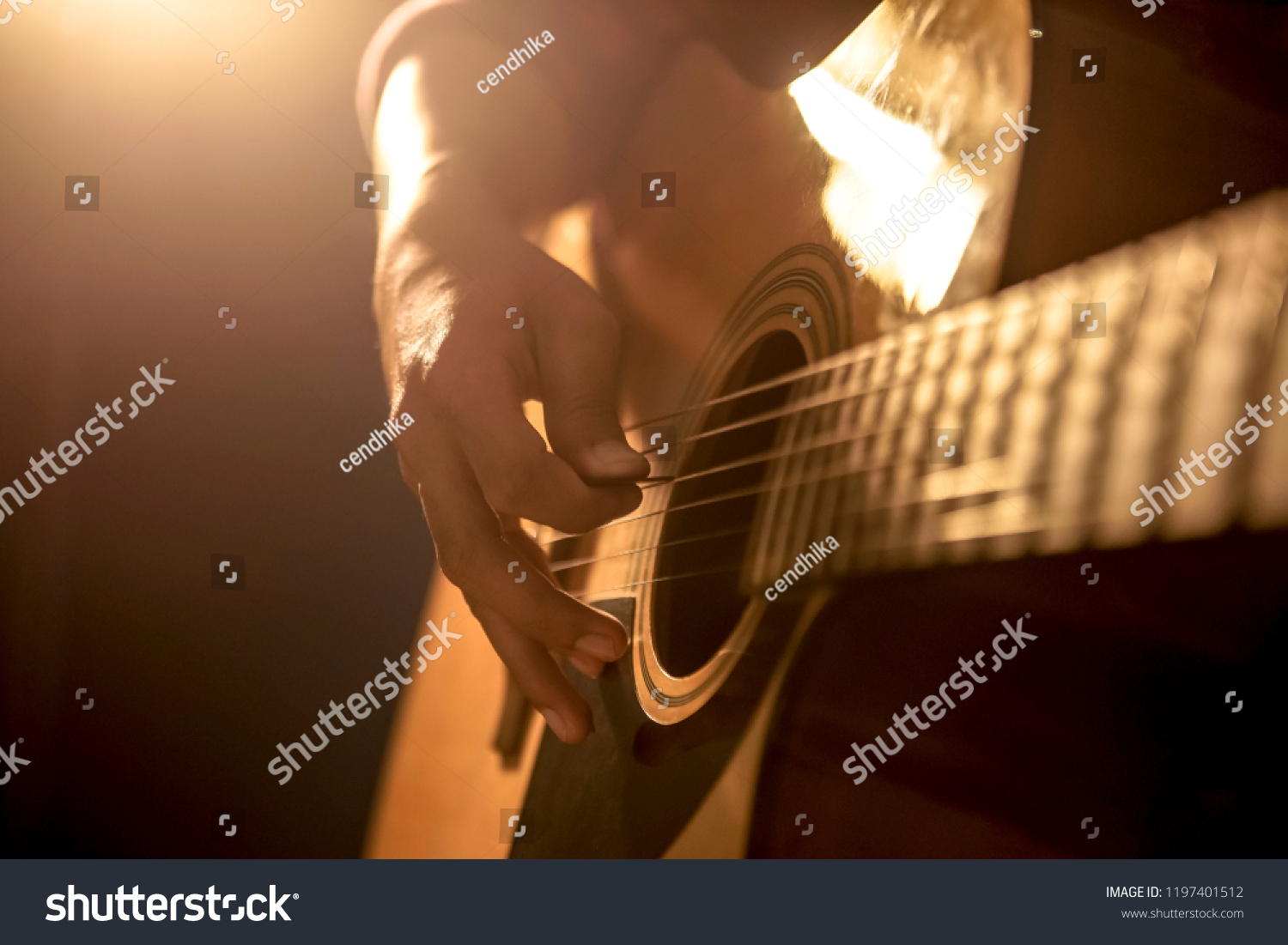 Man playing acoustic guitar #1197401512