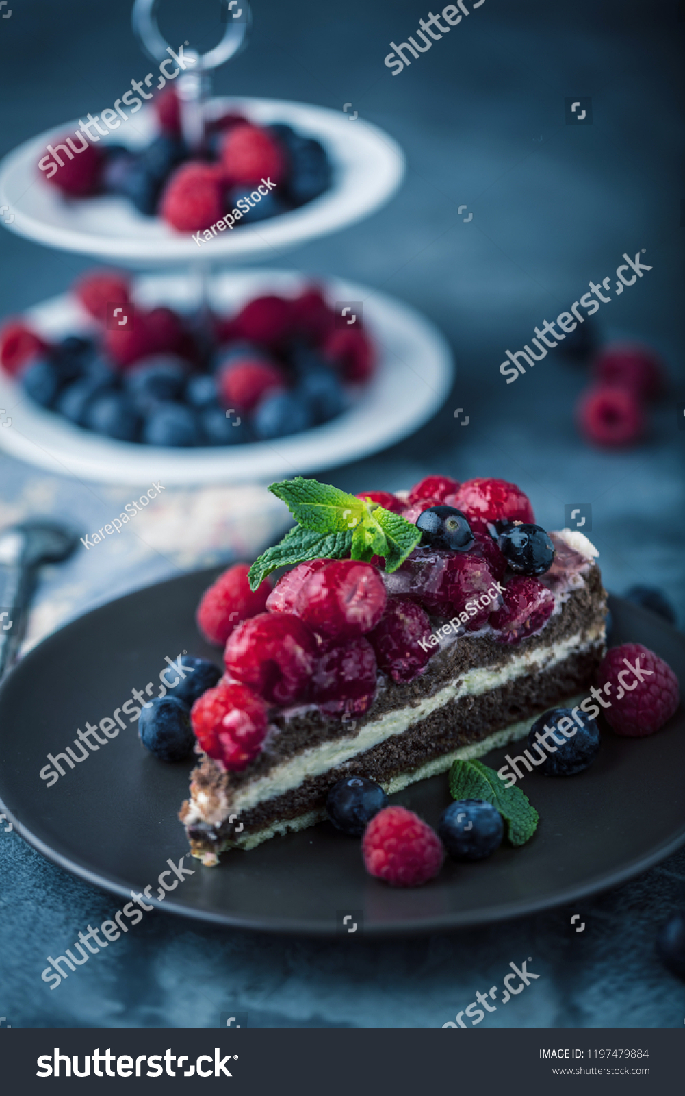 Portion of layered creamy fruit cake with in close up view #1197479884