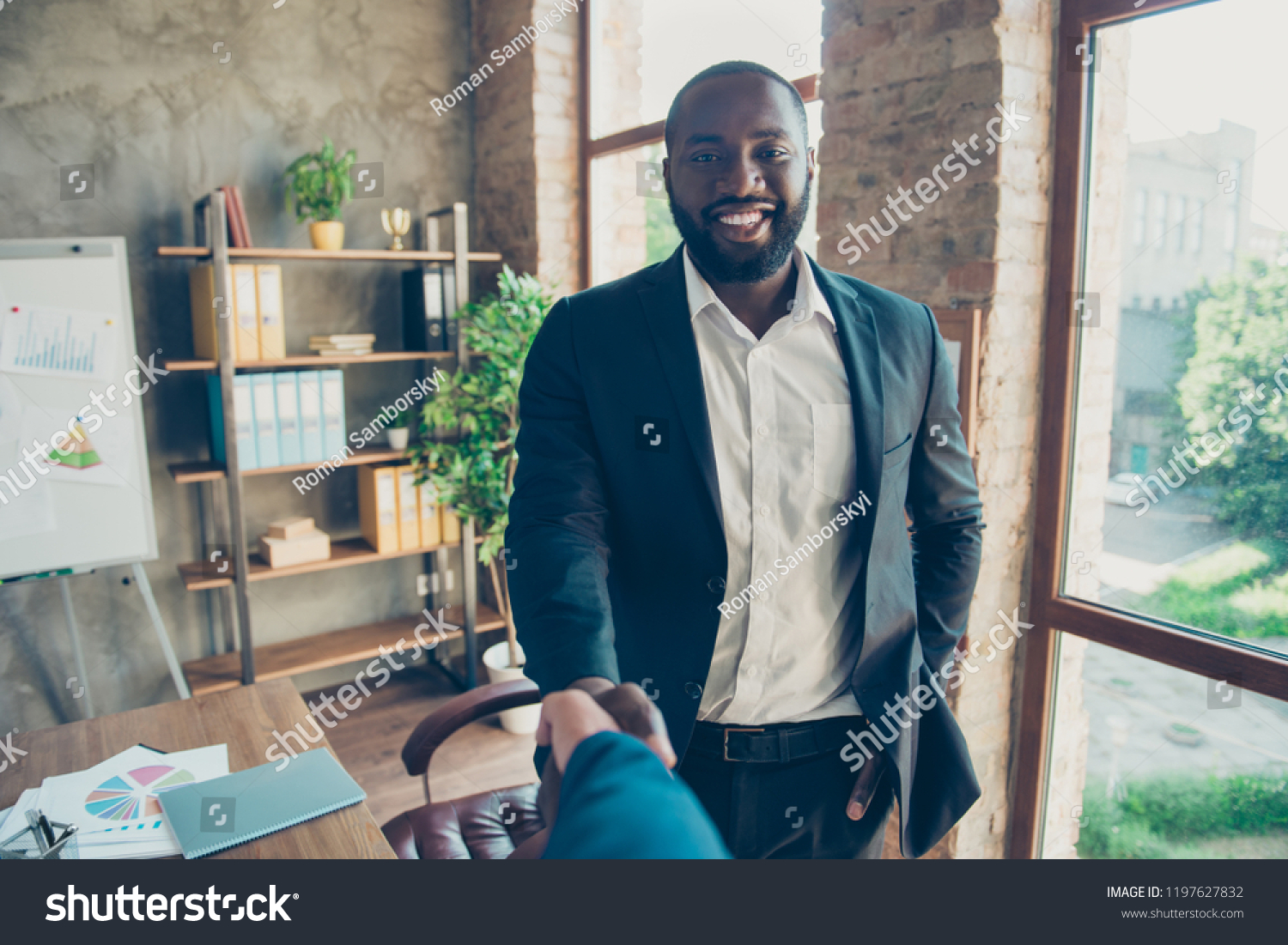 Elegant stylish classy cheerful positive business shark, bearded man in jacket shaking hands, hiring coworker at work place, work station #1197627832