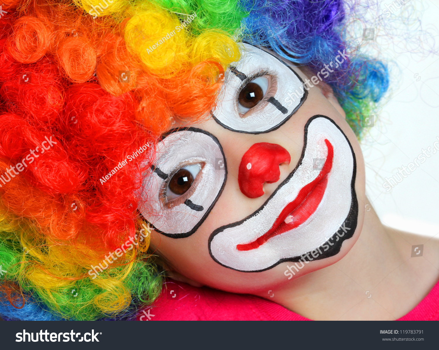 Pretty girl with face painting of a clown #119783791