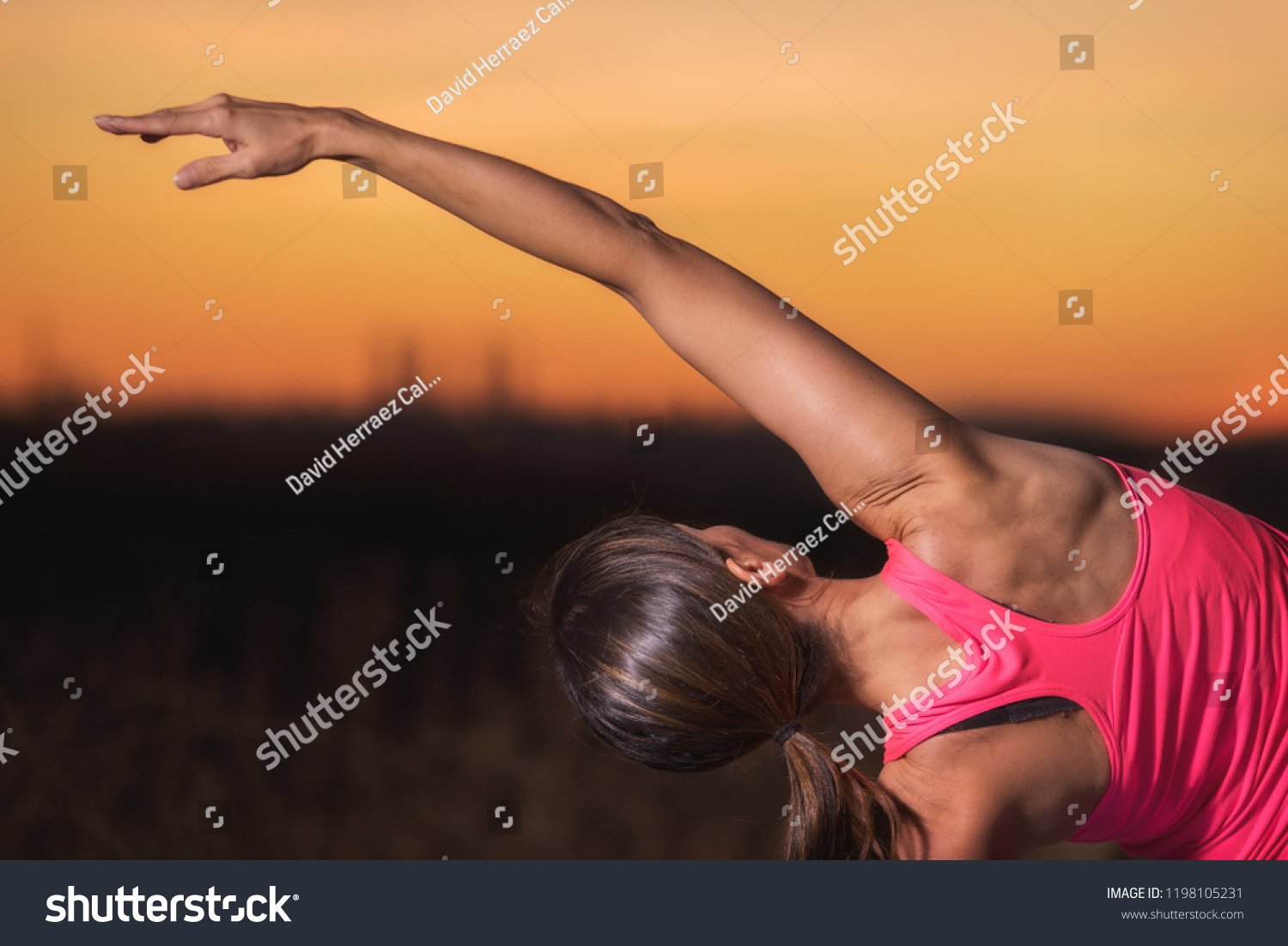 Young beautiful woman practicing Yoga at sunset #1198105231