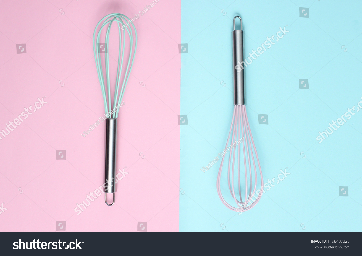 Two whisk on blue pink pastel background. Top view, minimalism
 #1198437328