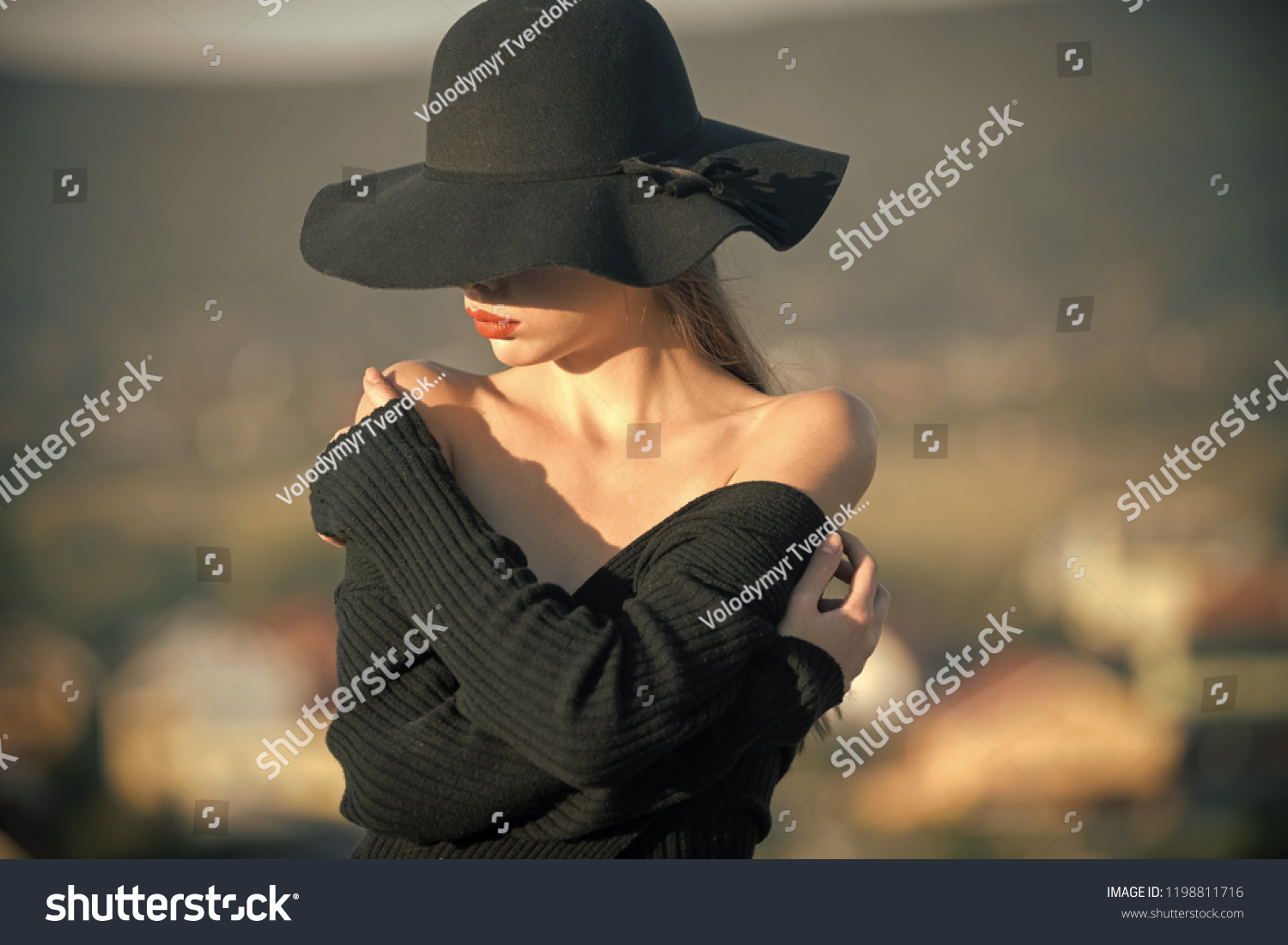 Beauty and fashion. beauty of pretty young woman in black hat #1198811716