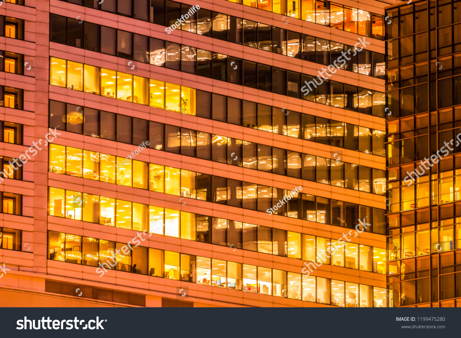 Beautiful exterior building and architecture of building with window and light pattern at night #1199475280