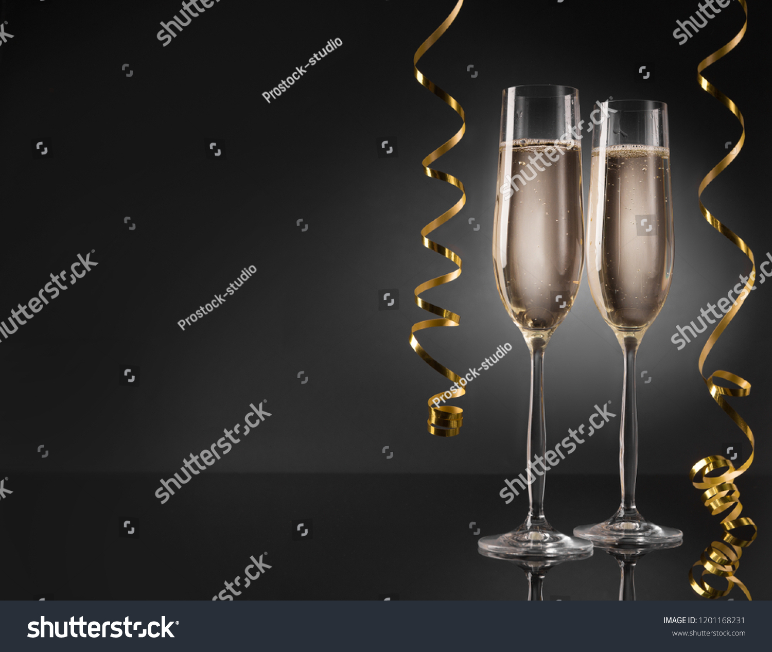 Two champagne glasses ready to bring in the New Year #1201168231