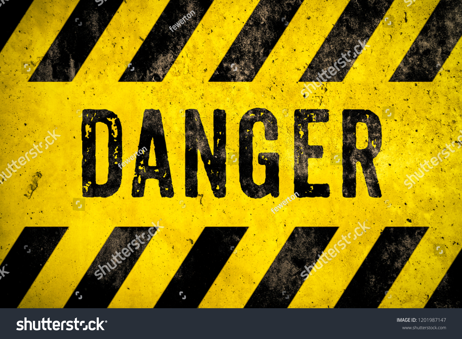 DANGER warning sign word text as stencil with yellow and black stripes painted over concrete wall cement texture background. Concept image for caution, dangerous area and hazard. #1201987147