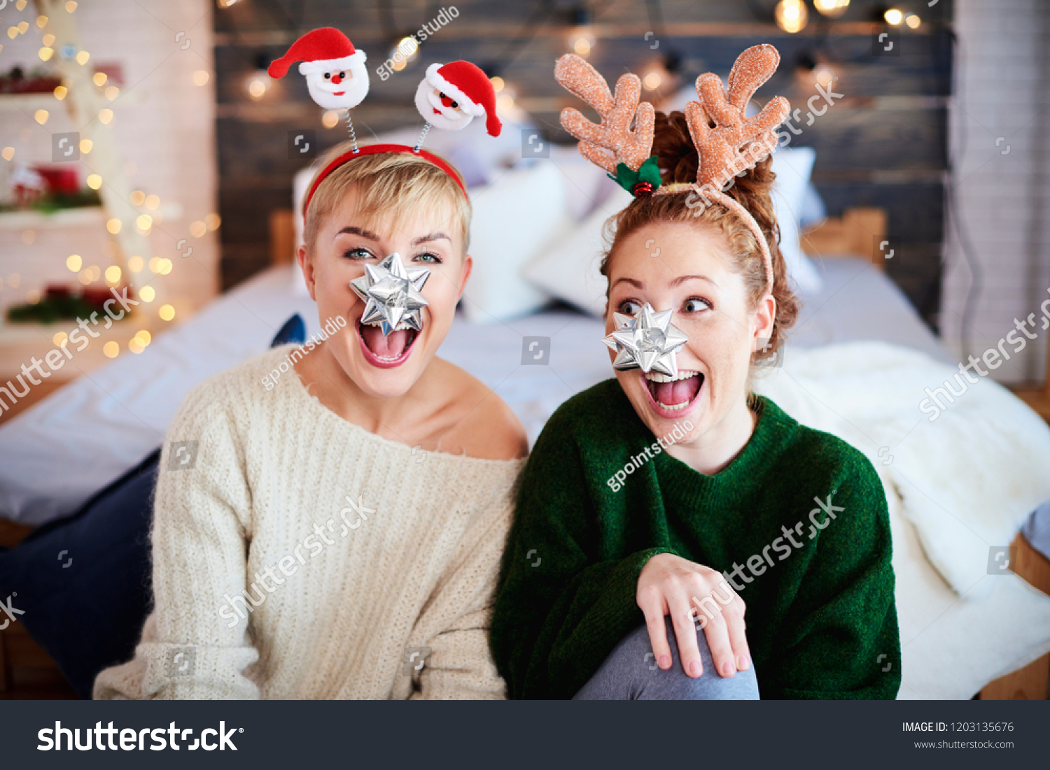 Portrait of playful friends at Christmas  #1203135676