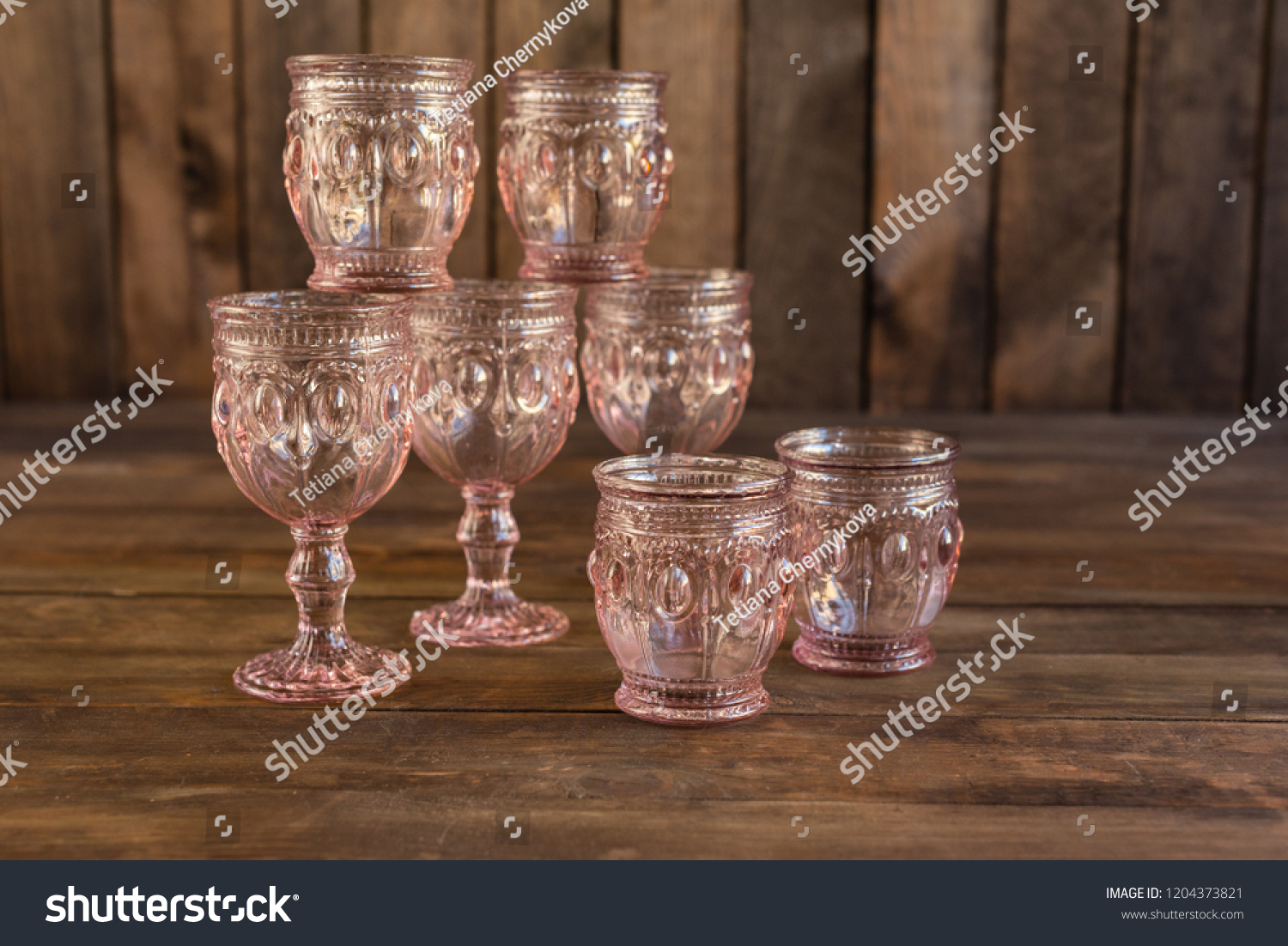 Beautiful glasses on a dark wooden background #1204373821