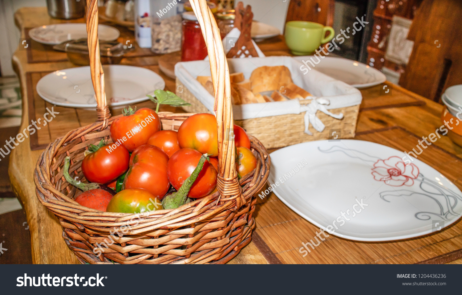 A basket of freshly picked organic tomatoes served for breakfast. #1204436236