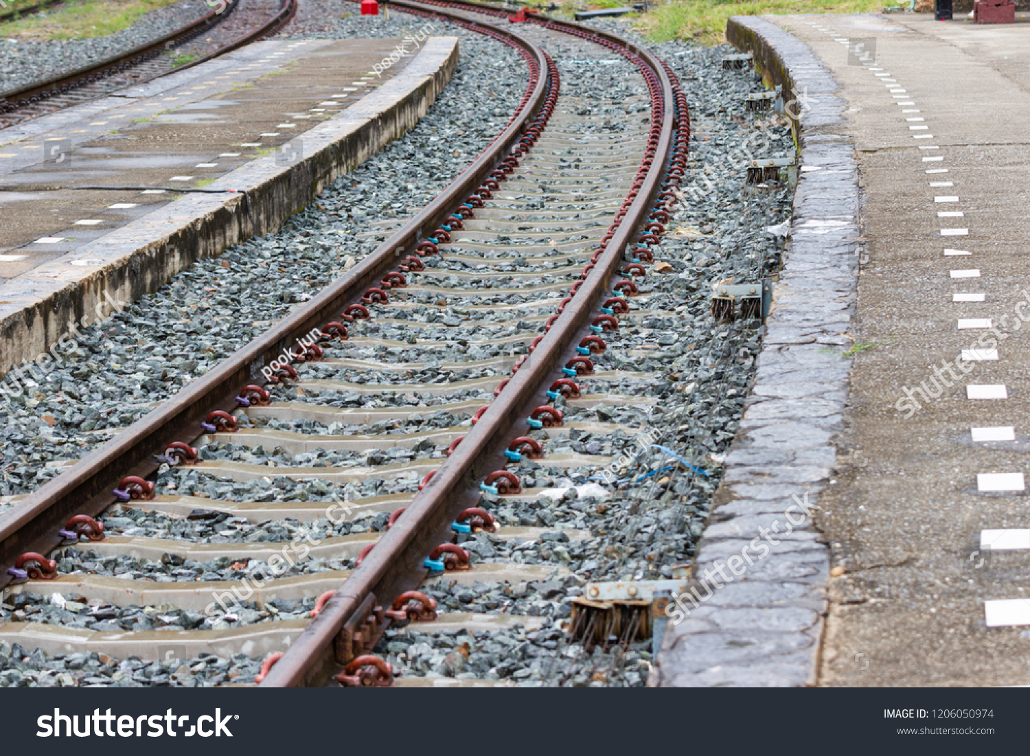 The railroad tracks curve along the way For train travel Bangkok Thailand. #1206050974