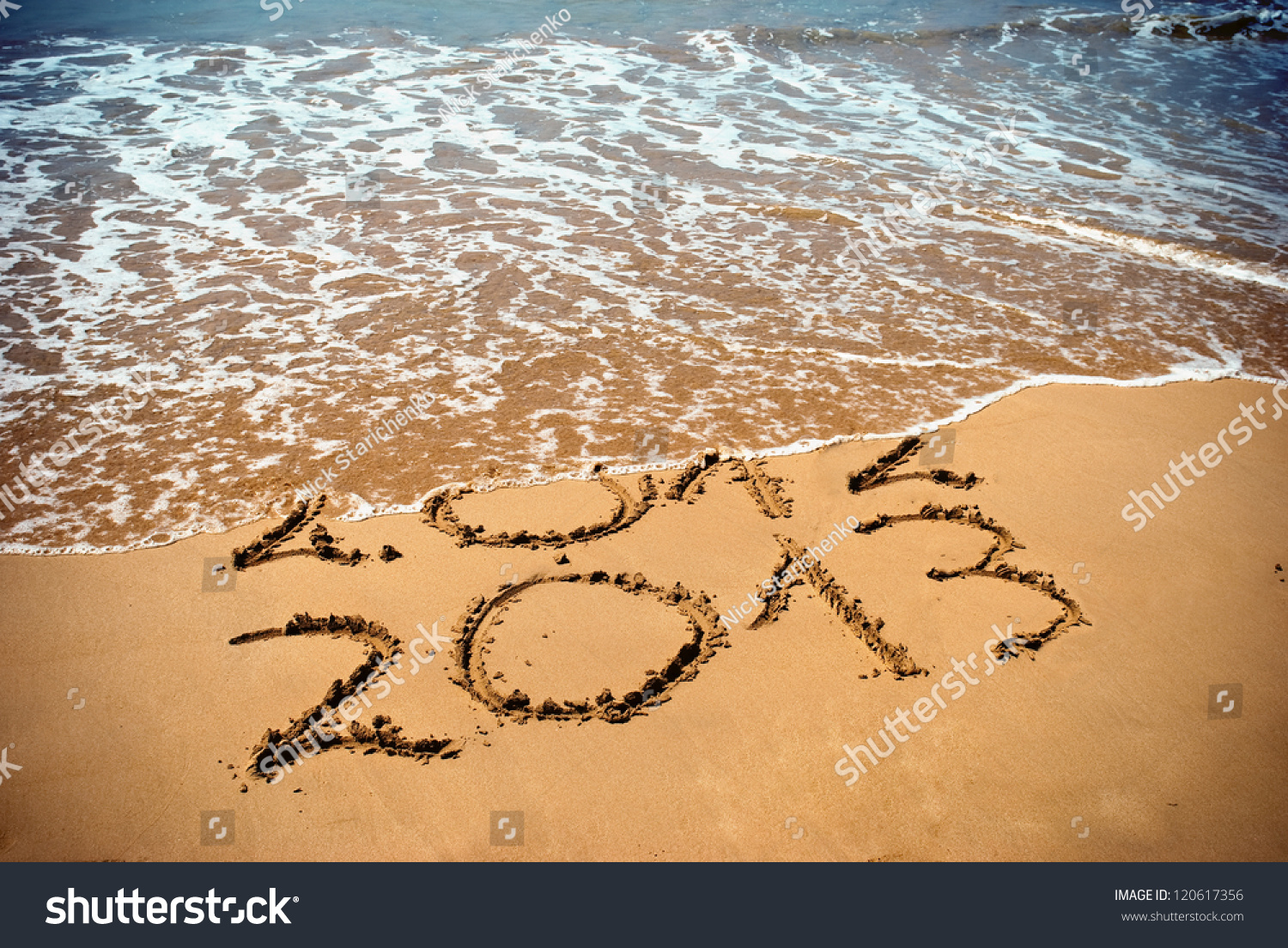 New Year 2013 is coming concept - inscription 2012 and 2013 on a beach sand, the wave is covering digits 2012 #120617356