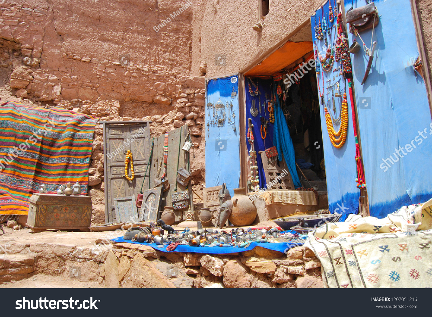 View of craft stalls at Kasbah Ait Ben Haddou near Ouarzazate in the Atlas Mountains of Morocco. UNESCO World Heritage Site since 1987. #1207051216