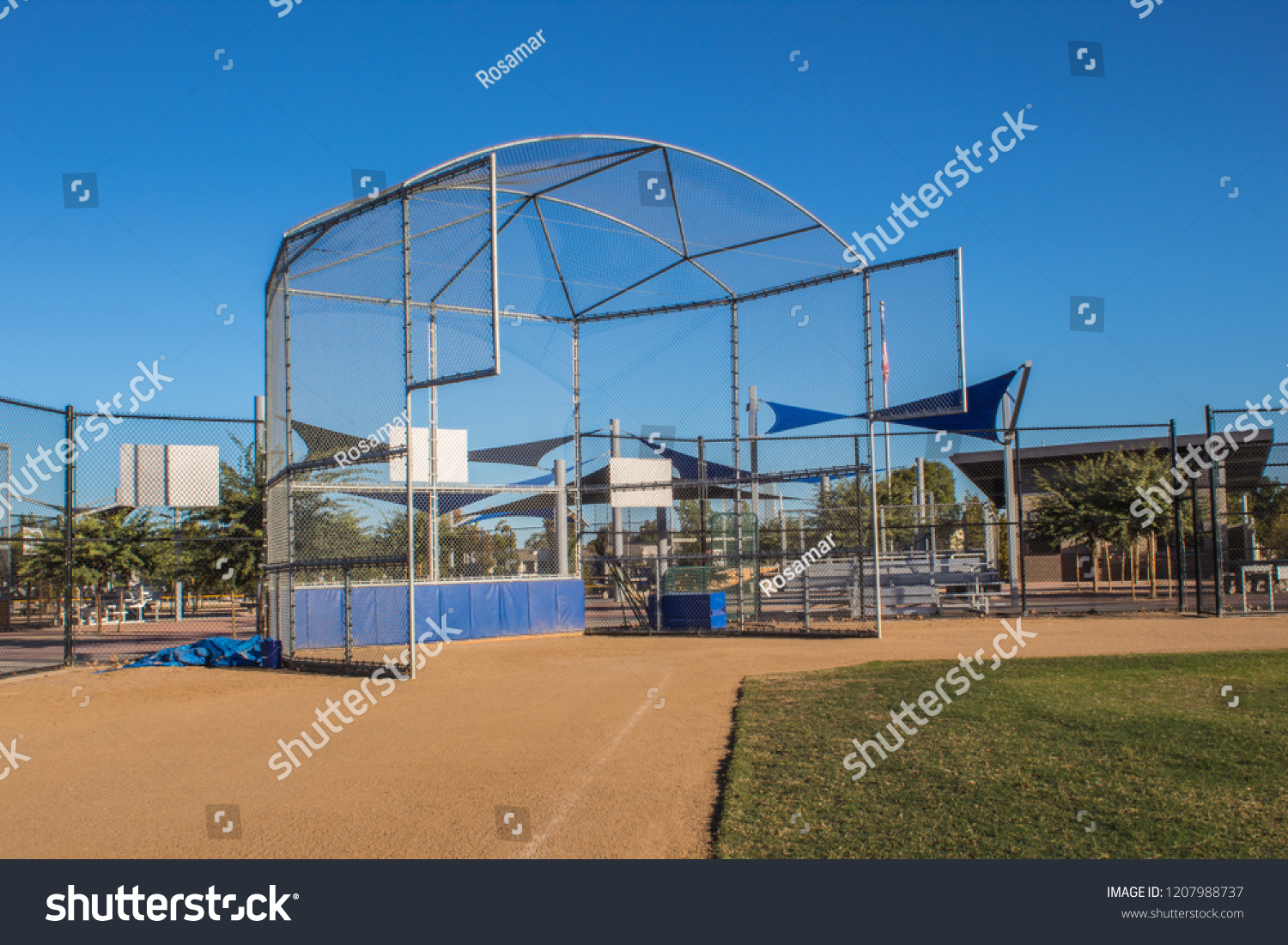 A baseball field batting cage #1207988737