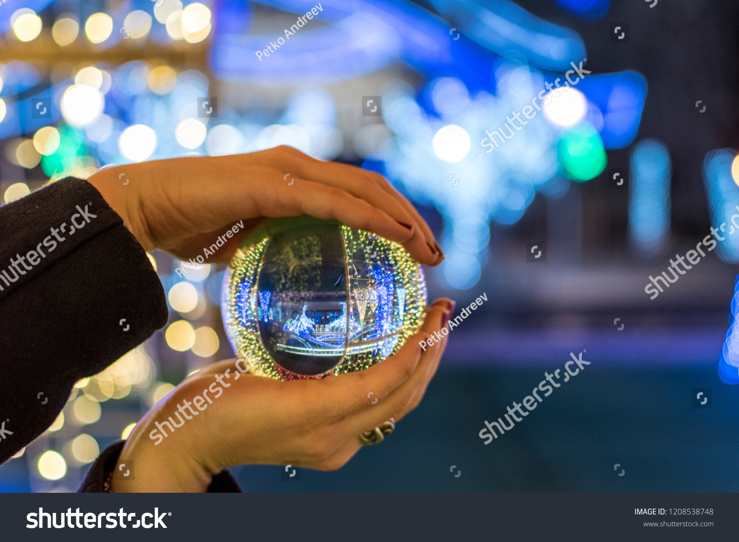 Christmas decoration caught through a glass sphere. #1208538748