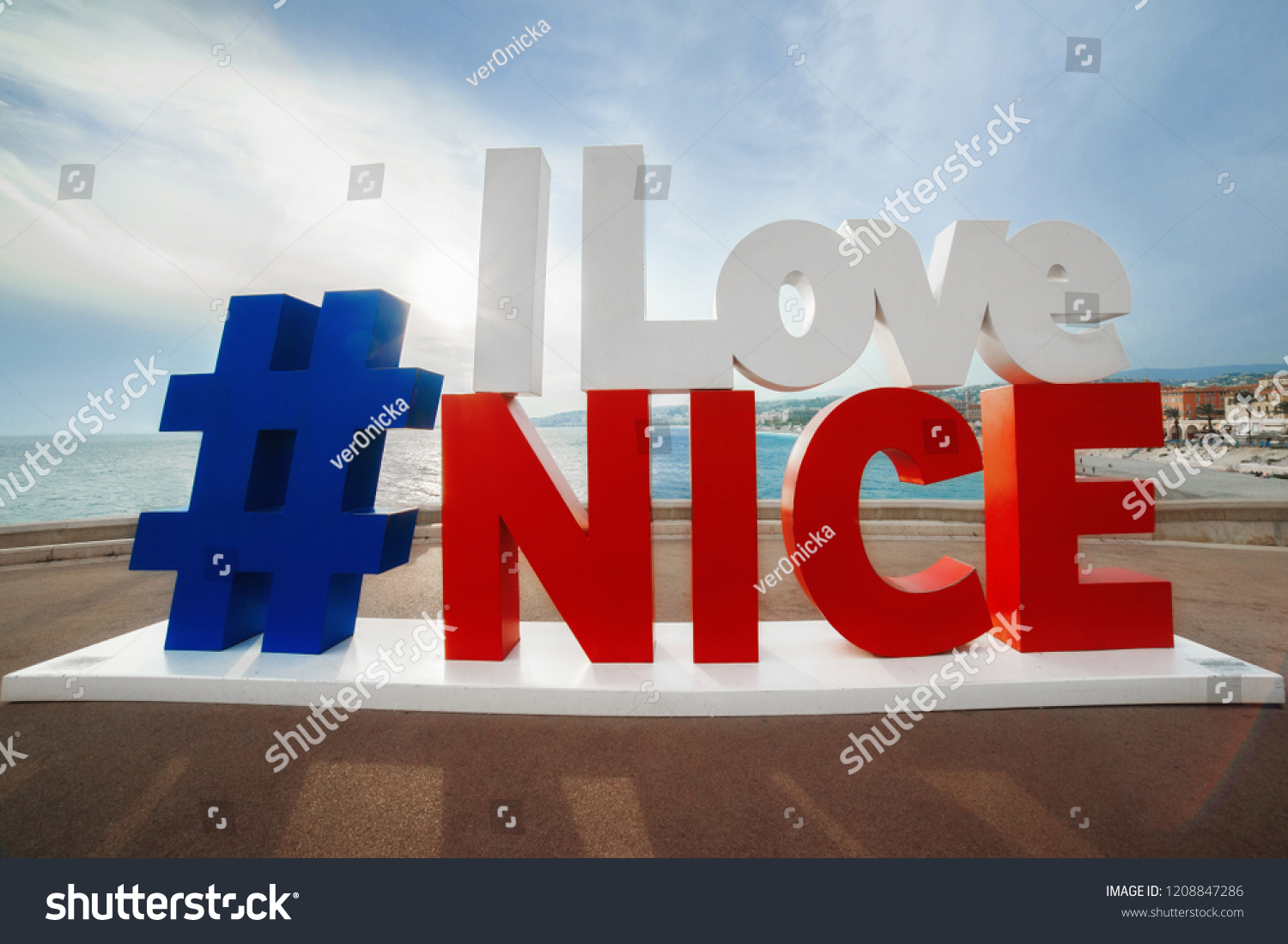  hashtag I Love Nice sign with the view of English Promenade, most famous touristic place #1208847286