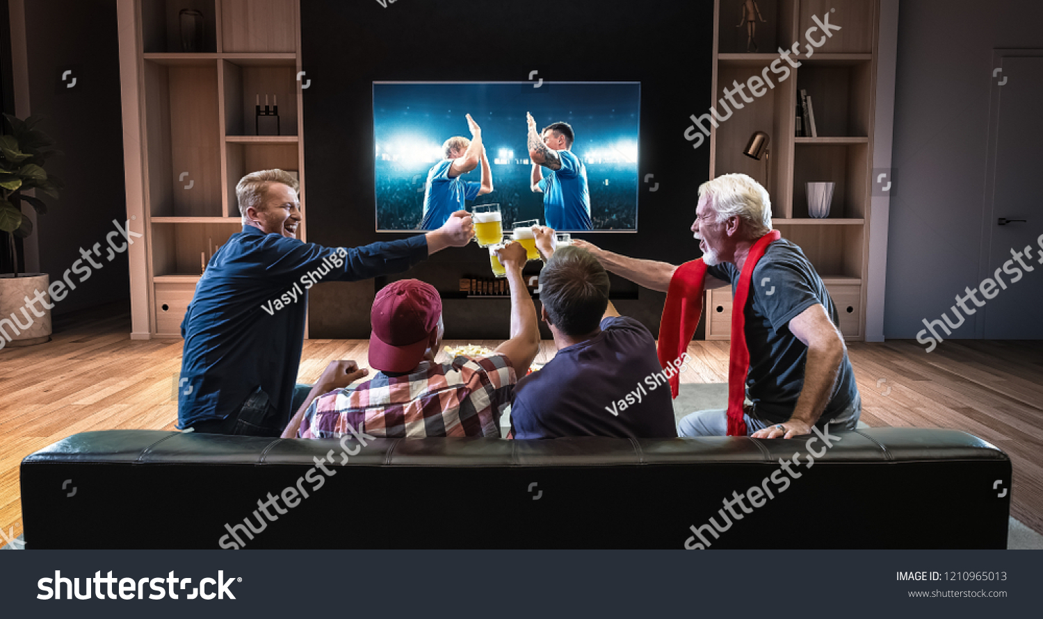 Group of fans are watching a soccer moment on the TV and celebrating a goal, sitting on the couch in the living room. The living room is made in 3D. #1210965013