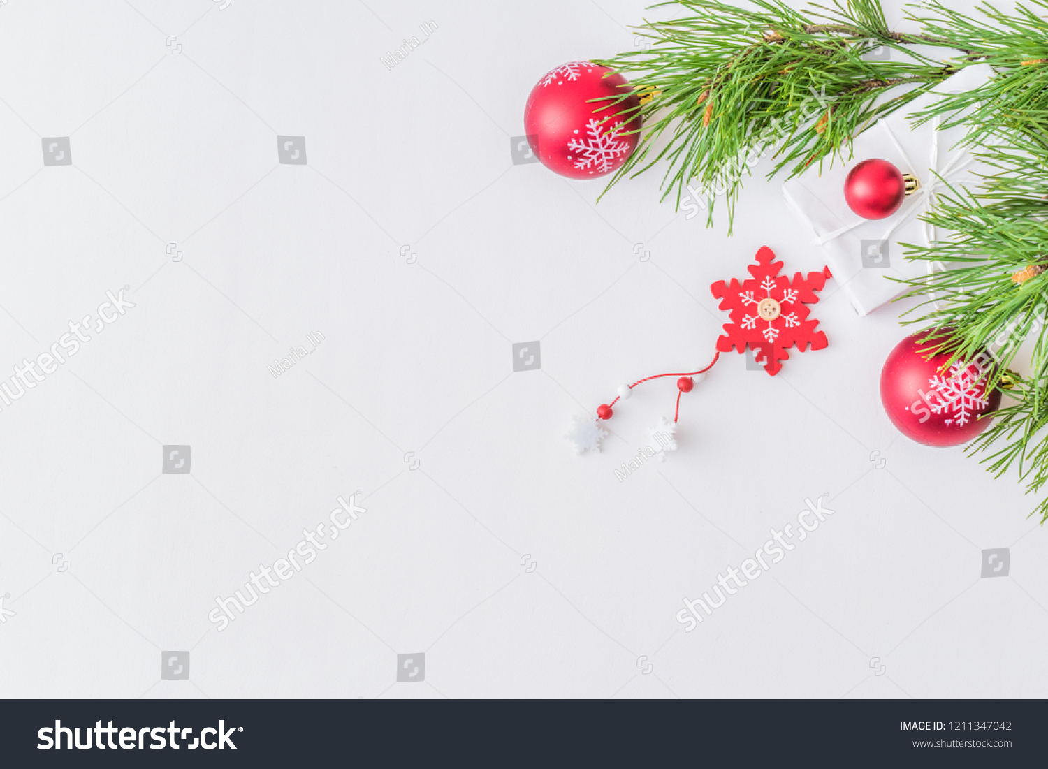 Holiday background with christmas branches and decoration on a light background #1211347042