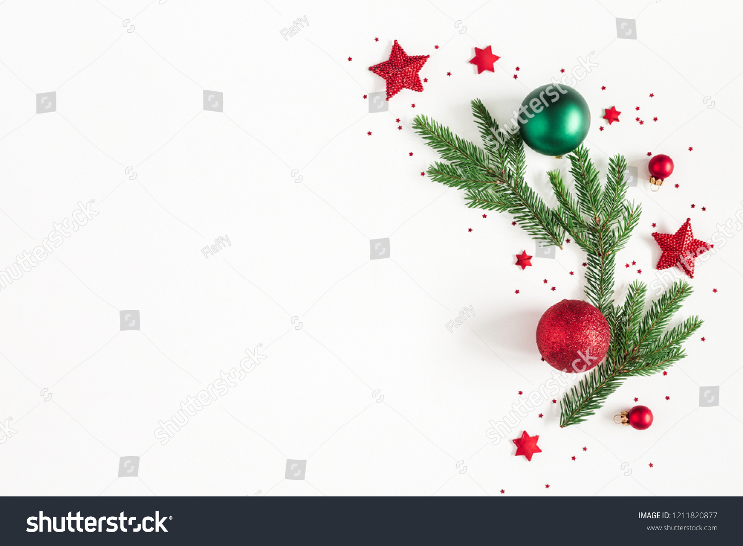 Christmas composition. Fir tree branches, red and green decorations on white background. Christmas, winter, new year concept. Flat lay, top view, copy space #1211820877
