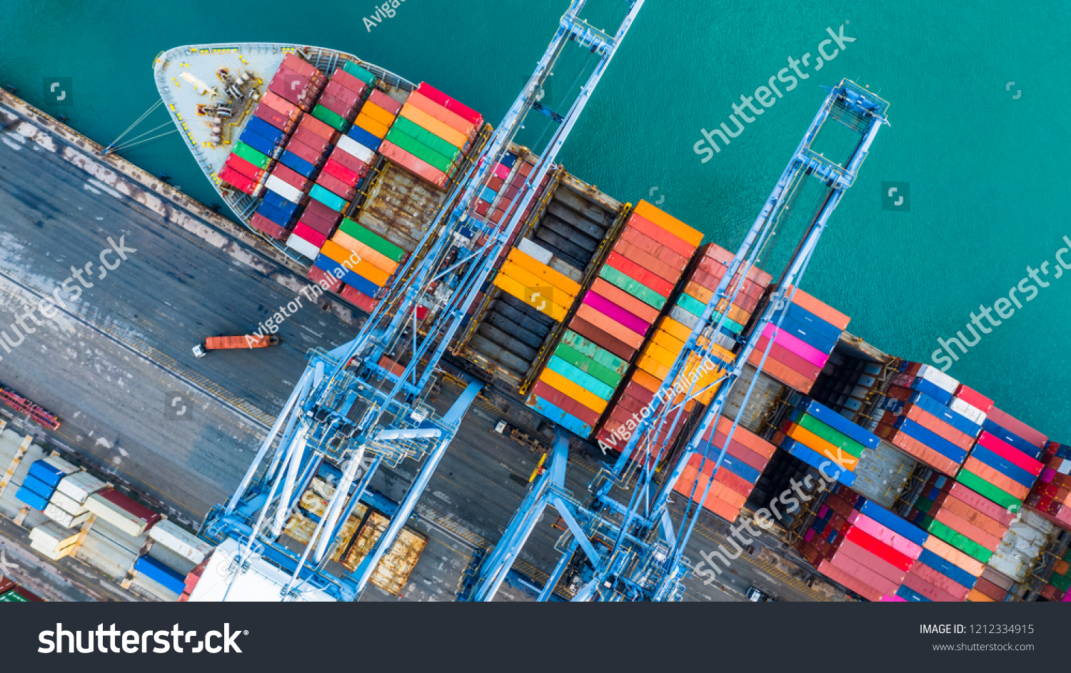Container ship loading at port with crane, container ship carrying container import and export business logistic and transportation, Aerial top view. #1212334915