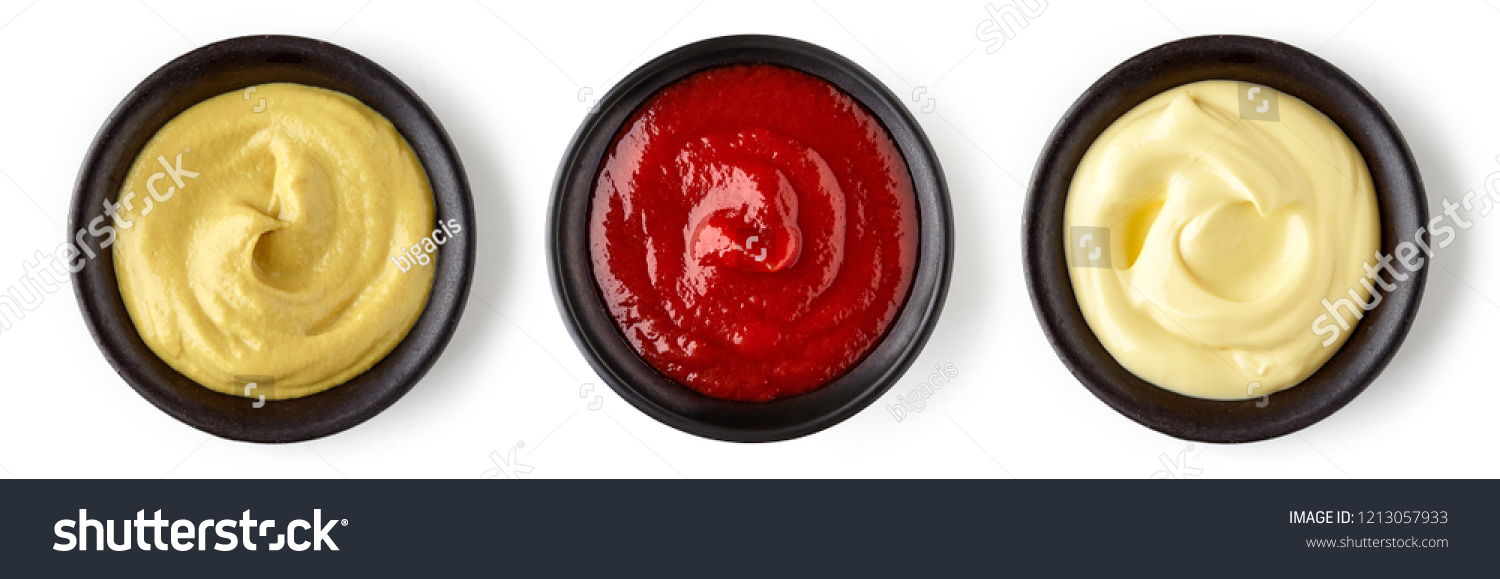 Bowls of ketchup mayonnaise and mustard isolated on white background, top view #1213057933