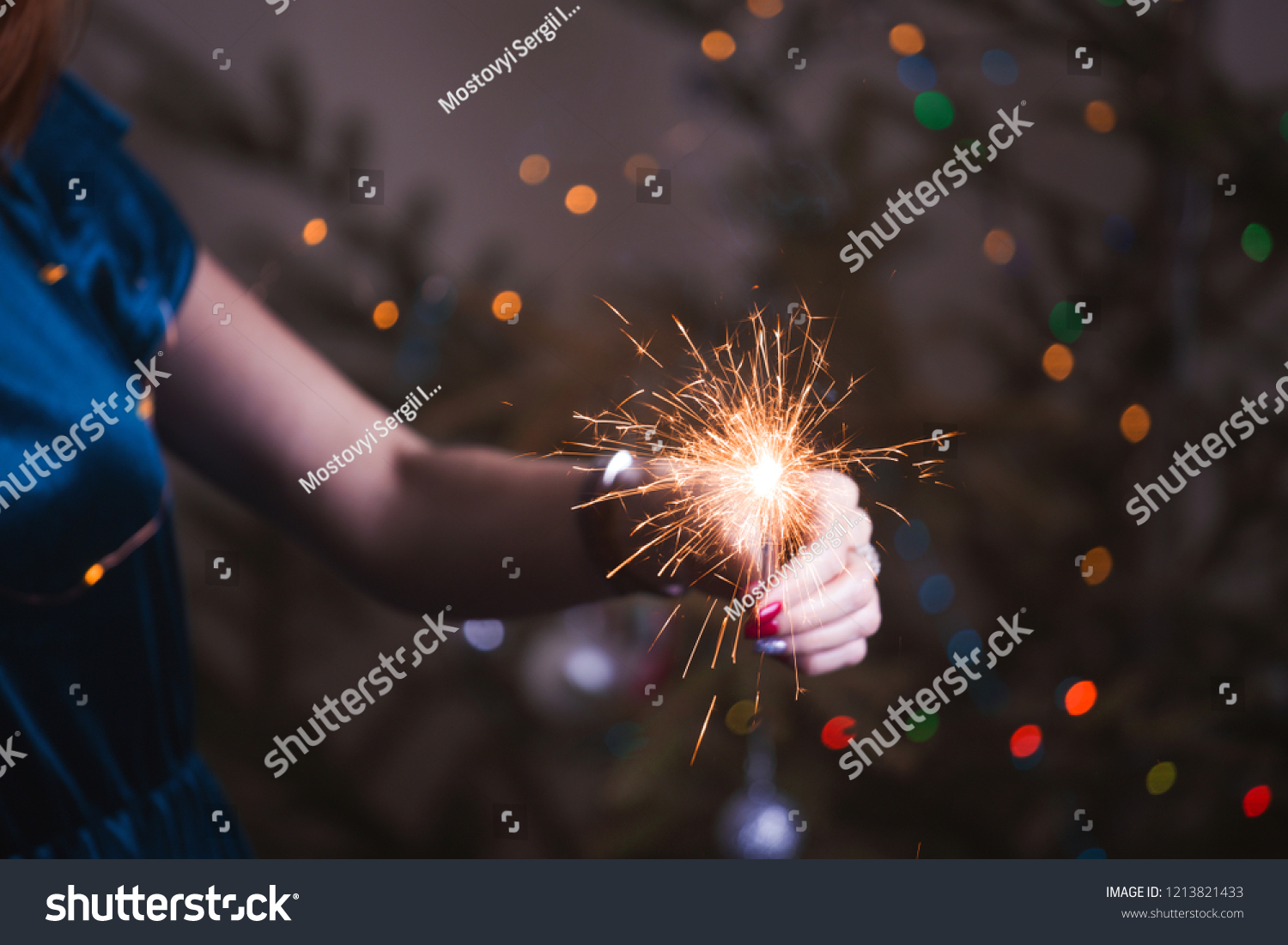girl holds bengal lights - happy christmas and merry holidays
 #1213821433