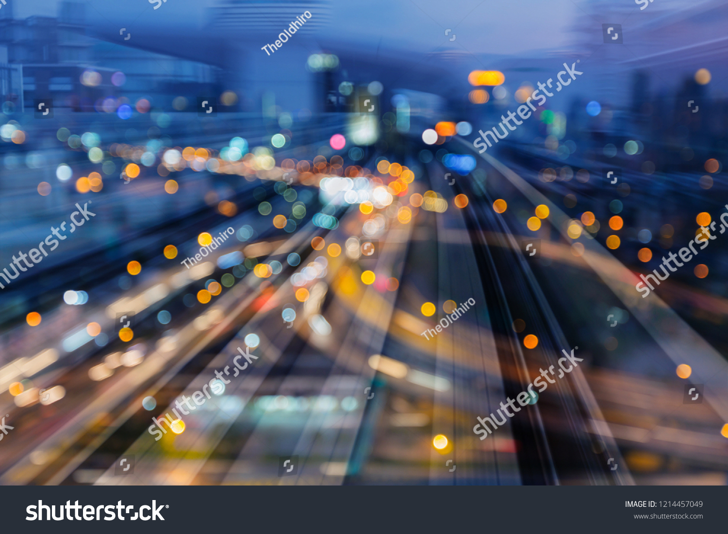 Night light bokeh city downtown over train track motion, abstract background #1214457049