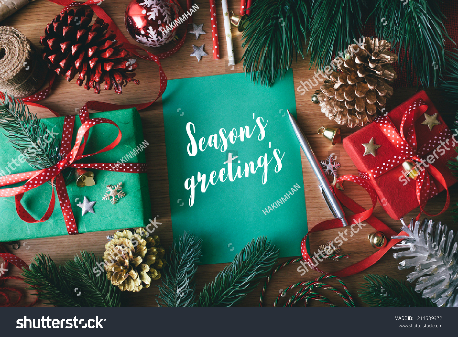 Season's greeting's concepts with cards and gift box present,ornament element on wood table background.Merry christmas and winter collection images #1214539972
