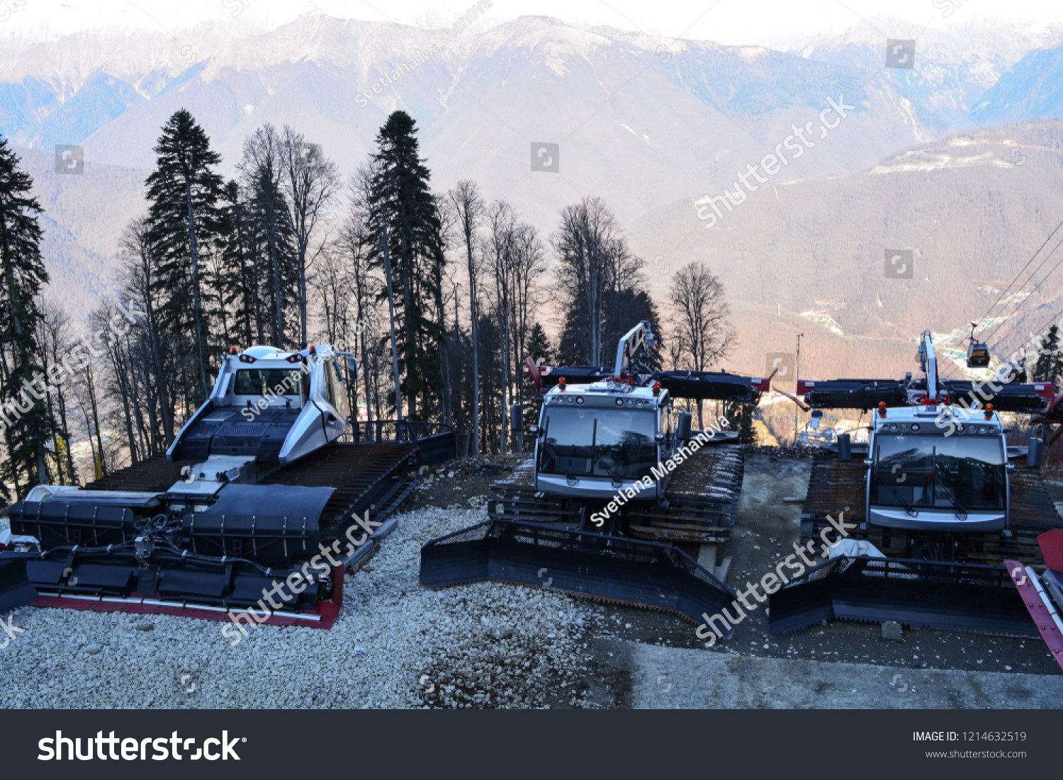 Sochi, Russia: Silver gray ratrak on the snow-covered slope of Caucasus mountains in Sochi. Ratrak are used to prepare slopes for skiers and for the docking of mountaineers. #1214632519
