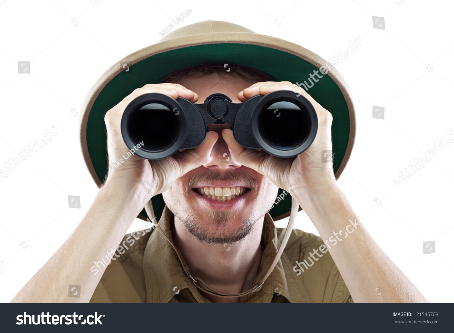 Happy young man wearing safari shirt and pith helmet looking through binoculars, isolated on white, close-up #121545703