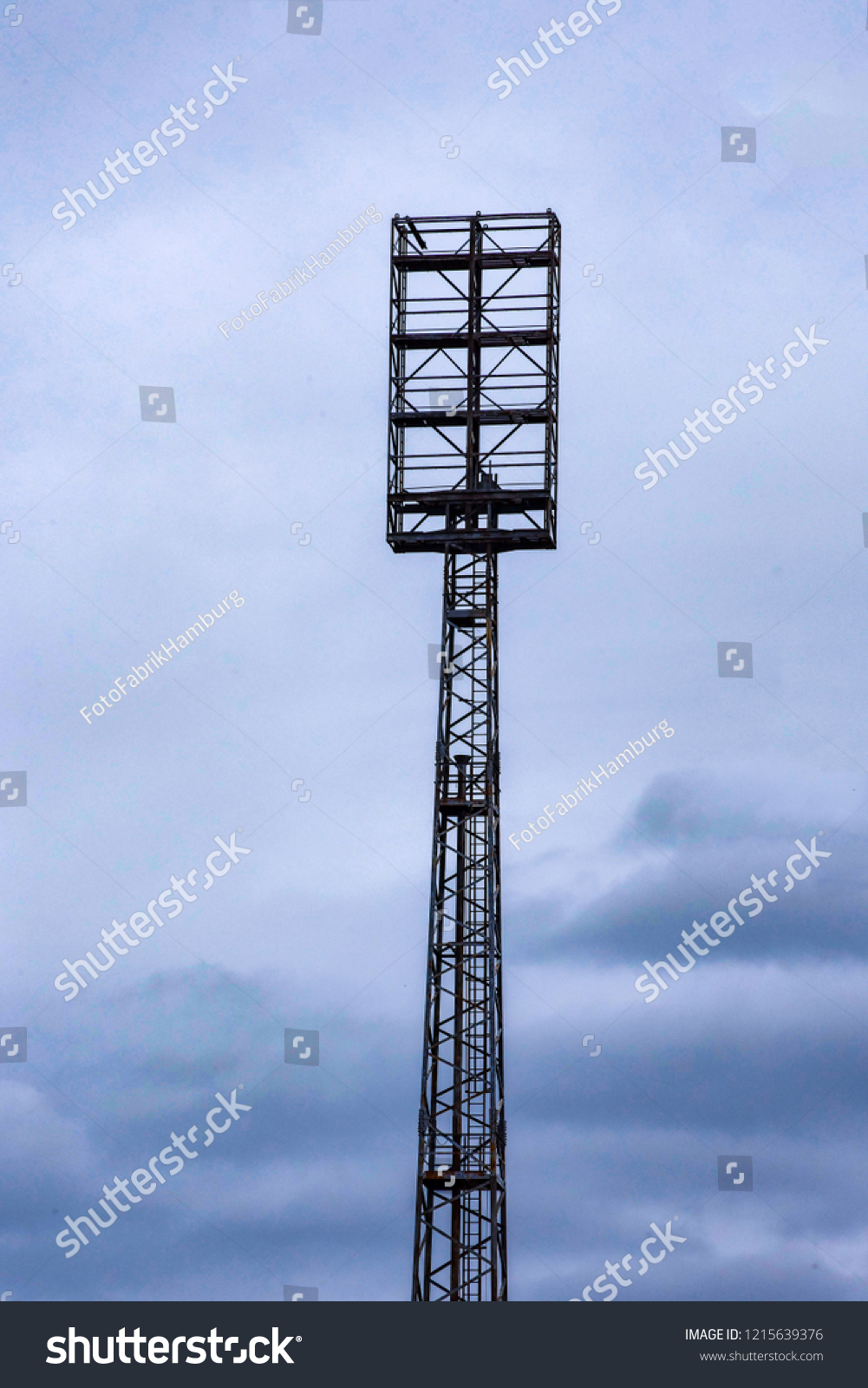 An old floodlight mast in a football stadium #1215639376