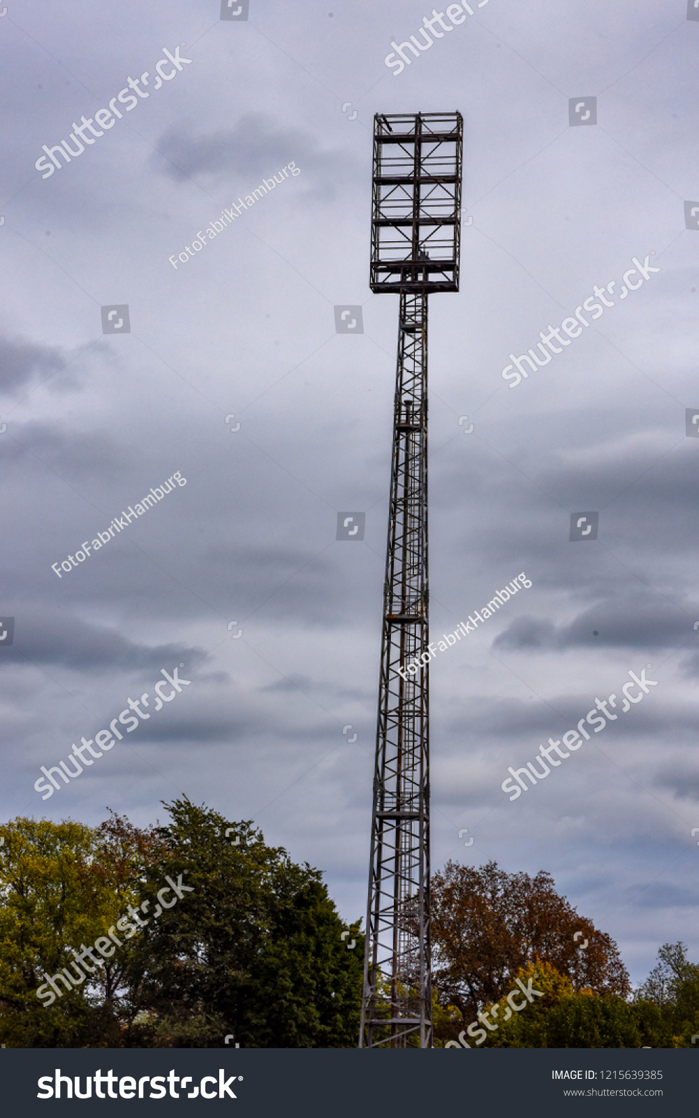 An old floodlight mast in a football stadium #1215639385