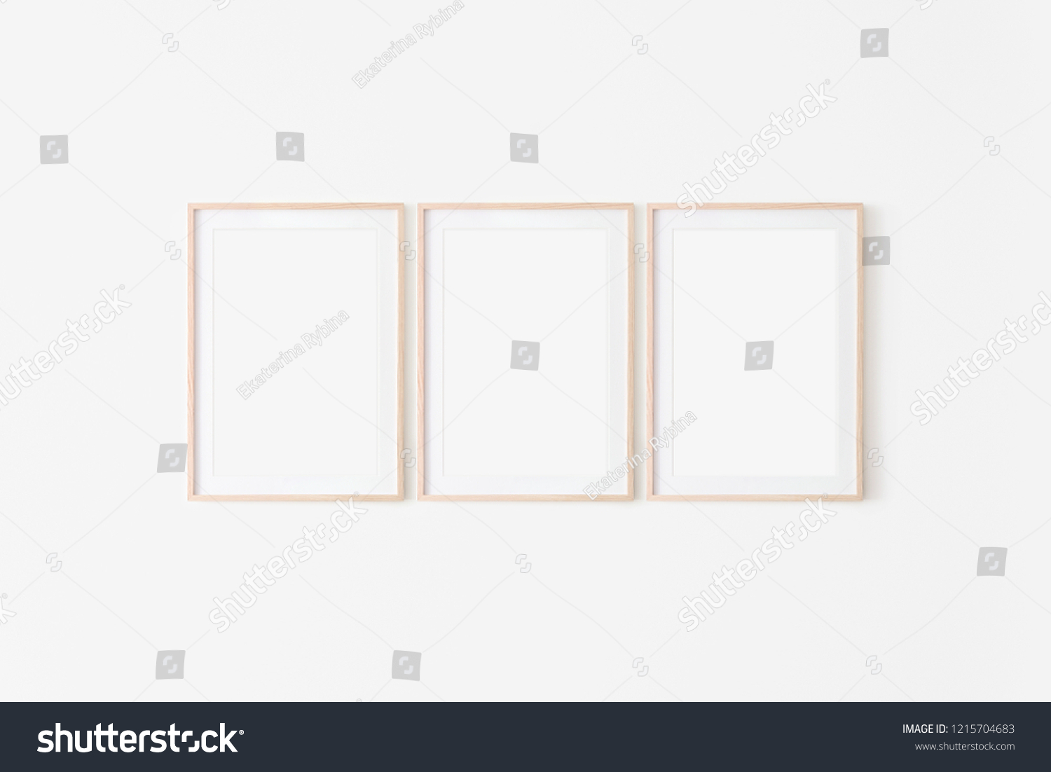 Set of three large 50x70, 20x28, a3,a4, Wooden frame mockup with backing board on white wall. Poster mockup. Clean, modern, minimal frame. Empty fra.me Indoor interior, show text or product #1215704683