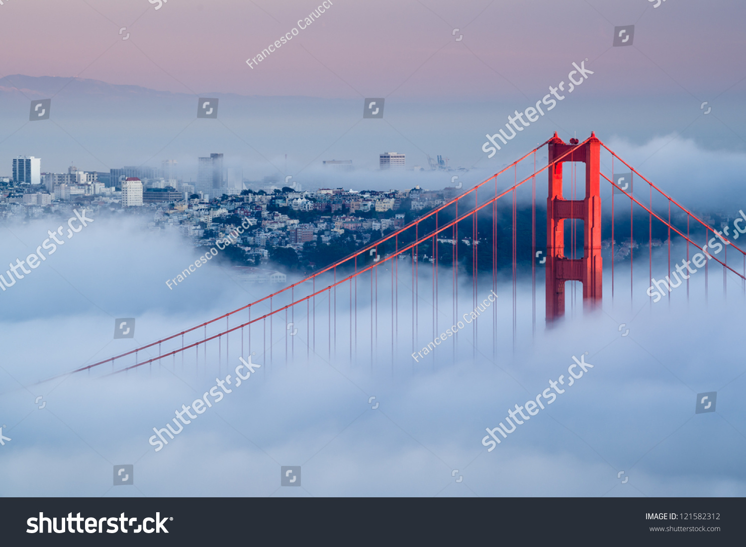 Golden Gate at dawn surrounded by fog #121582312