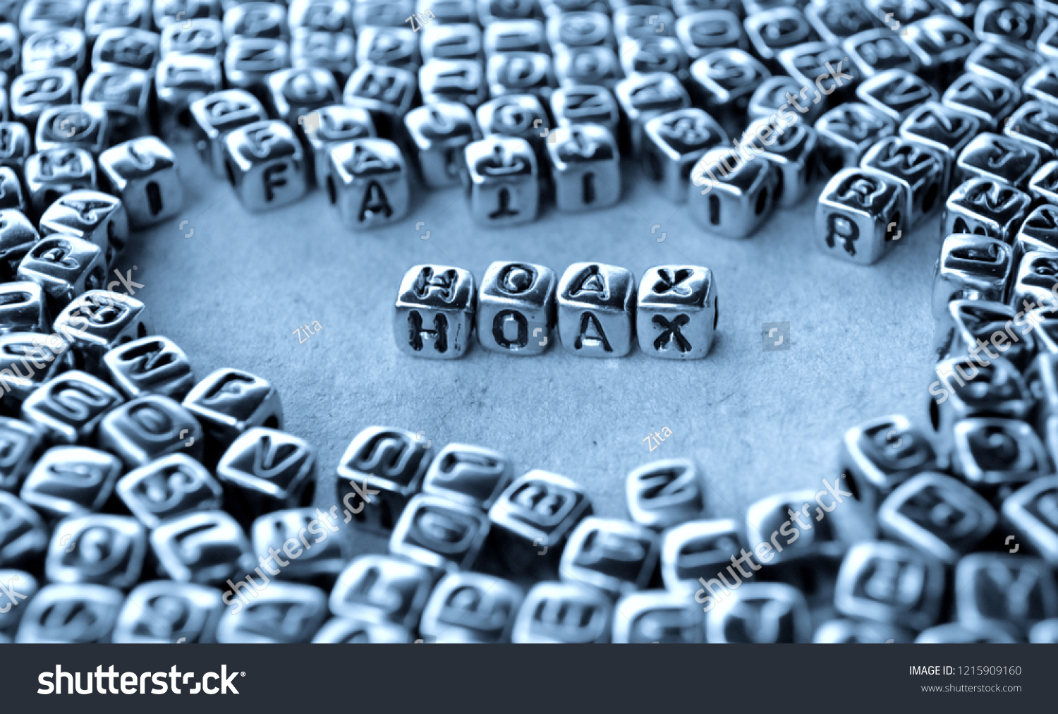 Hoax - Word from Metal Blocks on Paper - Concept Photo on Table
 #1215909160