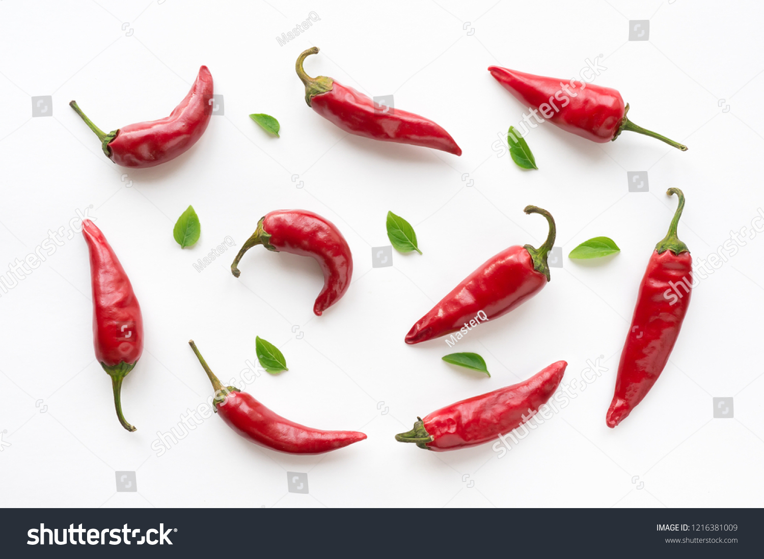 Red hot chilli peppers with green leaves on white background. Food pattern.  #1216381009