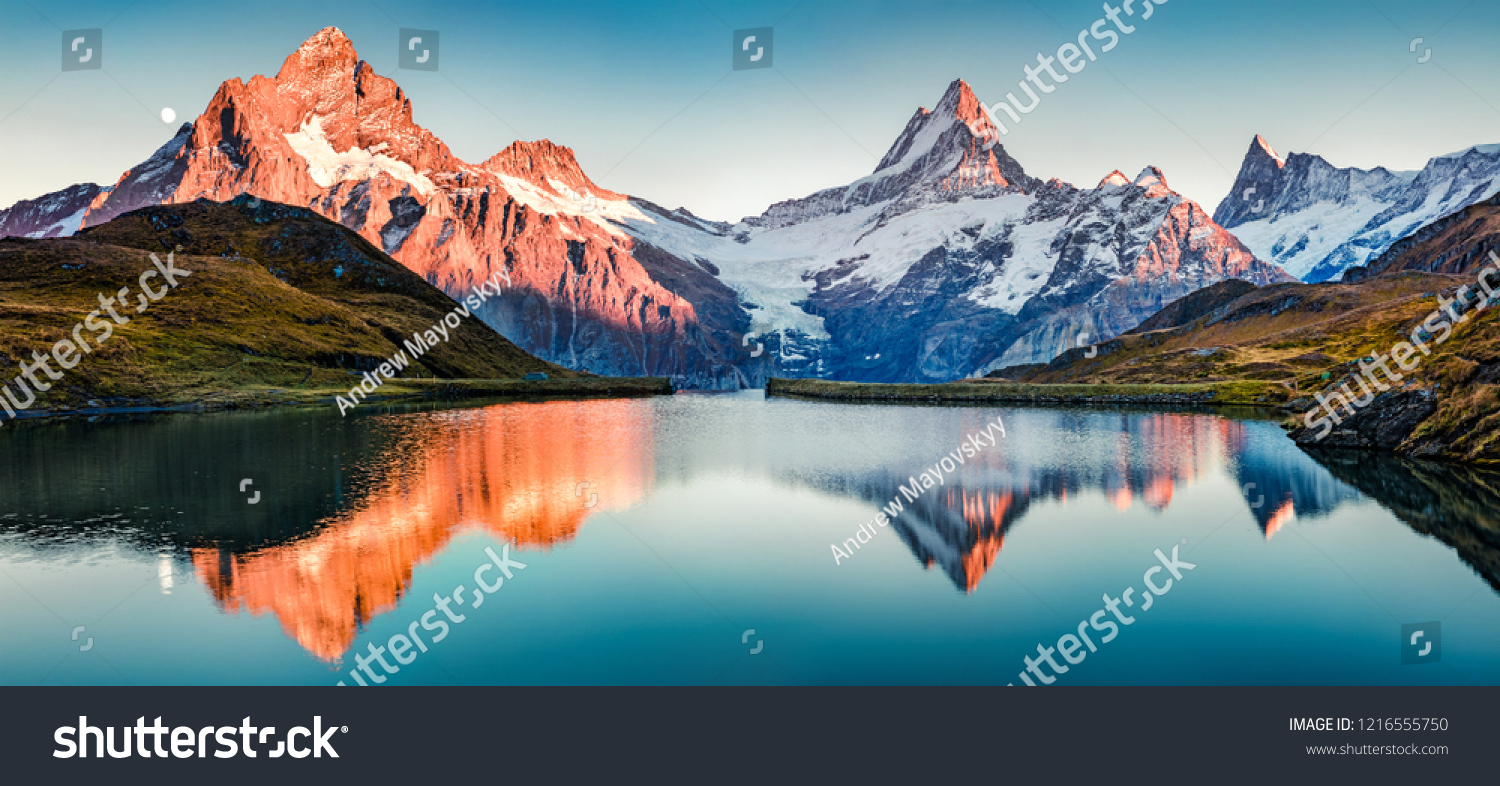 Fantastic evening panorama of Bachalp lake / Bachalpsee, Switzerland. Picturesque autumn sunset in Swiss alps, Grindelwald, Bernese Oberland, Europe. Beauty of nature concept background. #1216555750