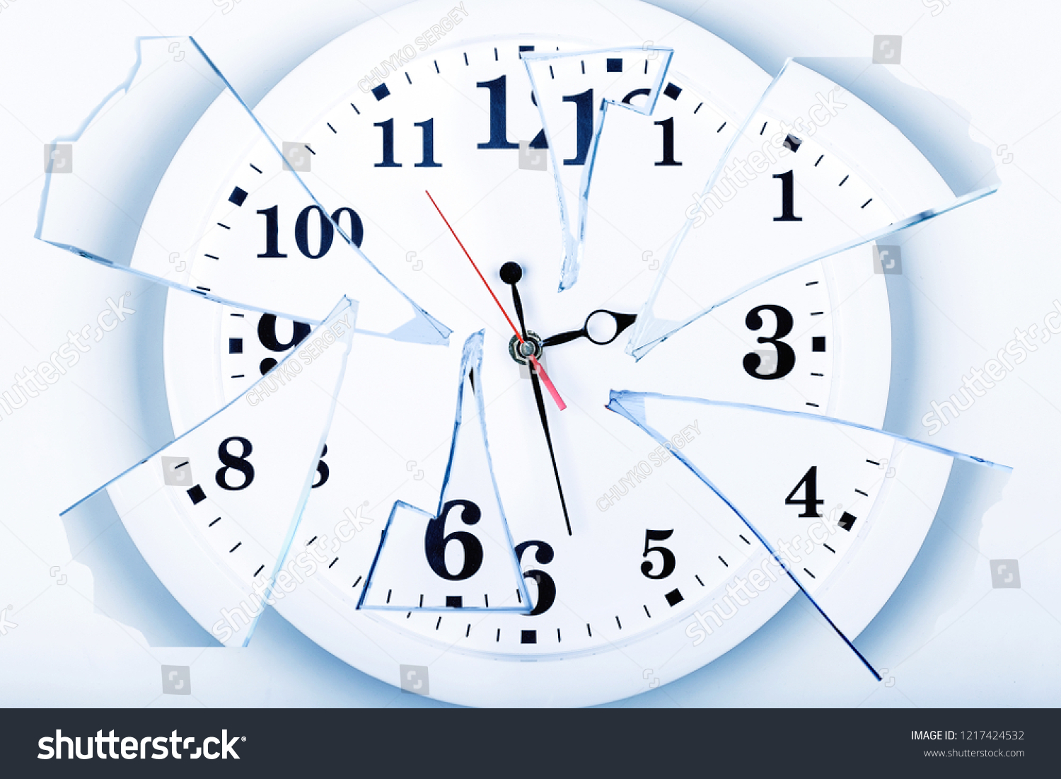 clock with broken glass on a white background. chaos time. time passing concept. #1217424532