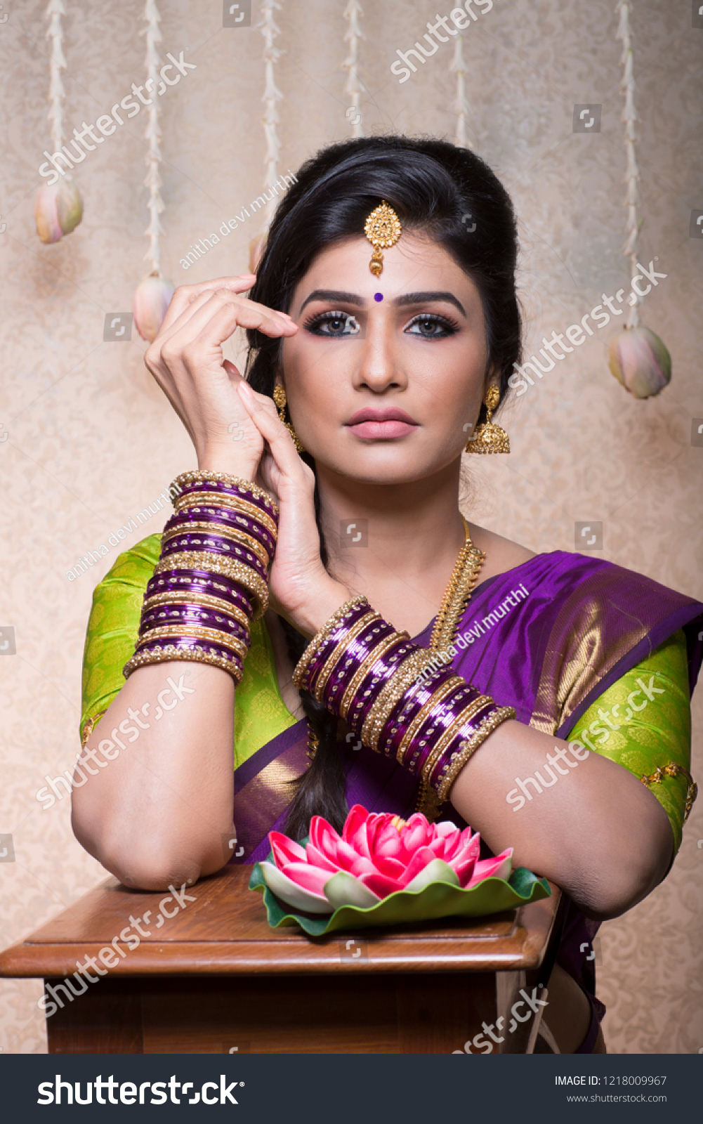 beautiful charming traditional indian bride, woman in indoor lighting  #1218009967