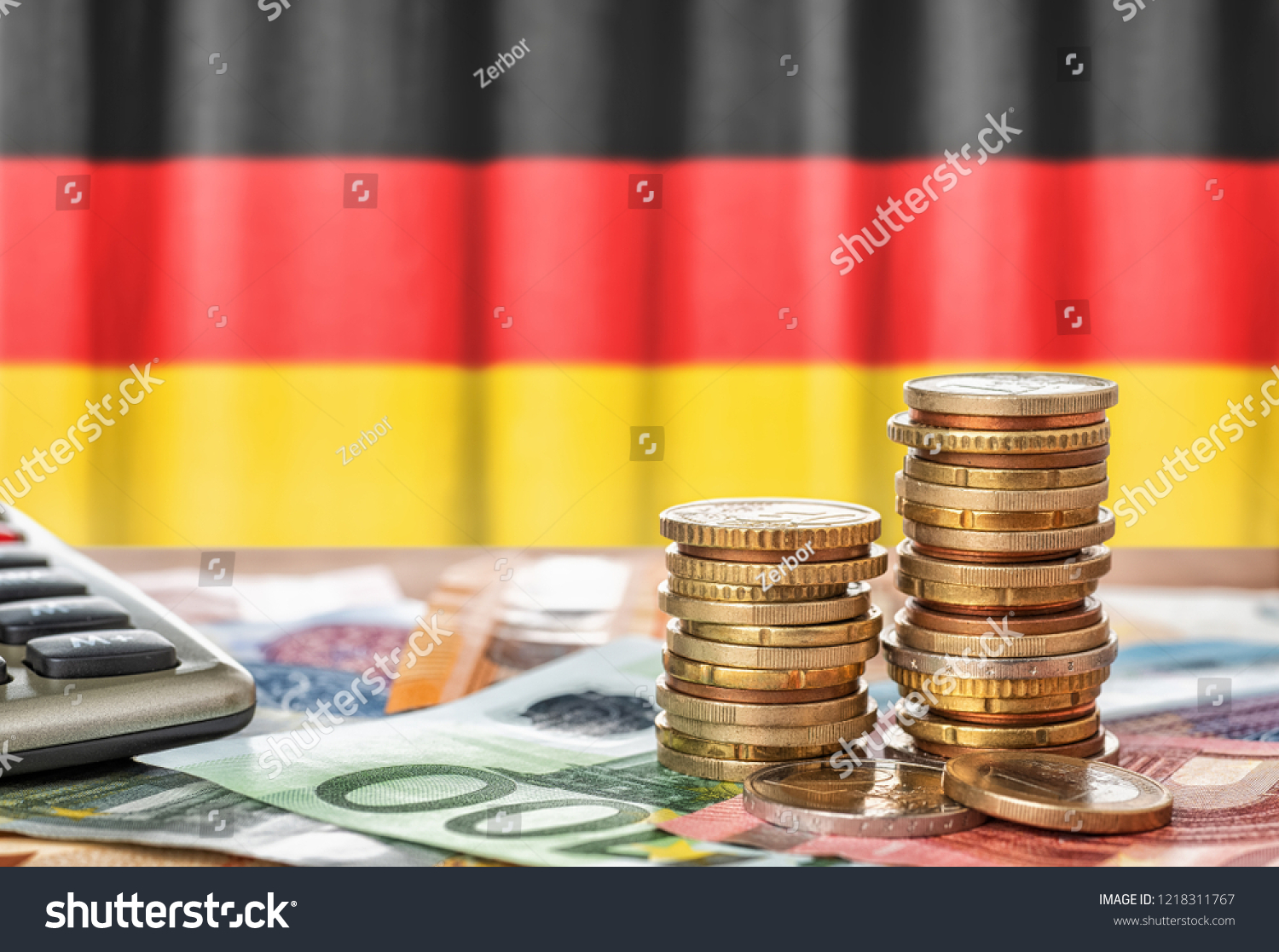 Euro banknotes and coins in front of the national flag of Germany #1218311767