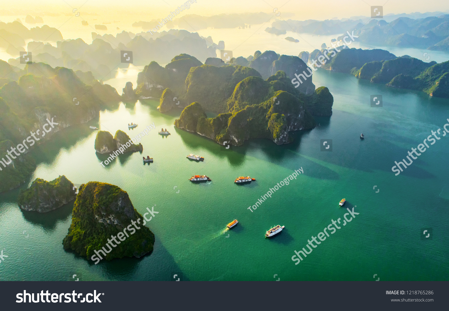 Aerial view floating fishing village and rock island, Halong Bay, Vietnam, Southeast Asia. UNESCO World Heritage Site. Junk boat cruise to Ha Long Bay. Popular landmark, famous destination of Vietnam
 #1218765286