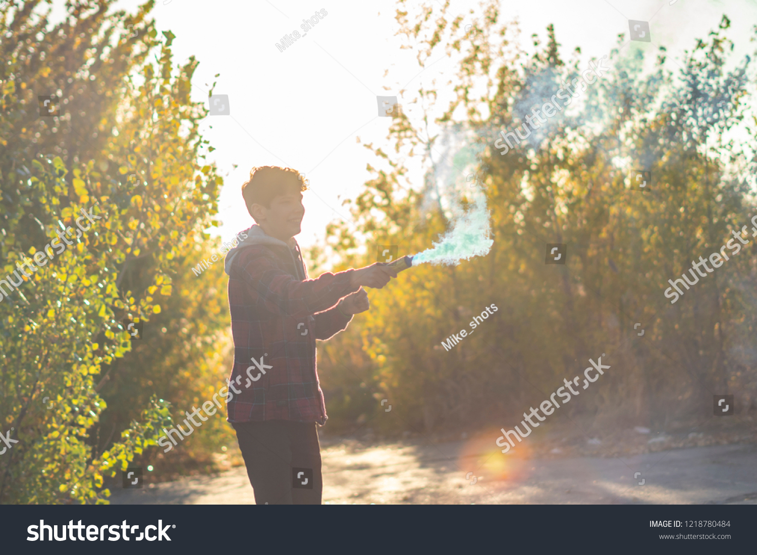 young man have fun with smoke fire cracker #1218780484