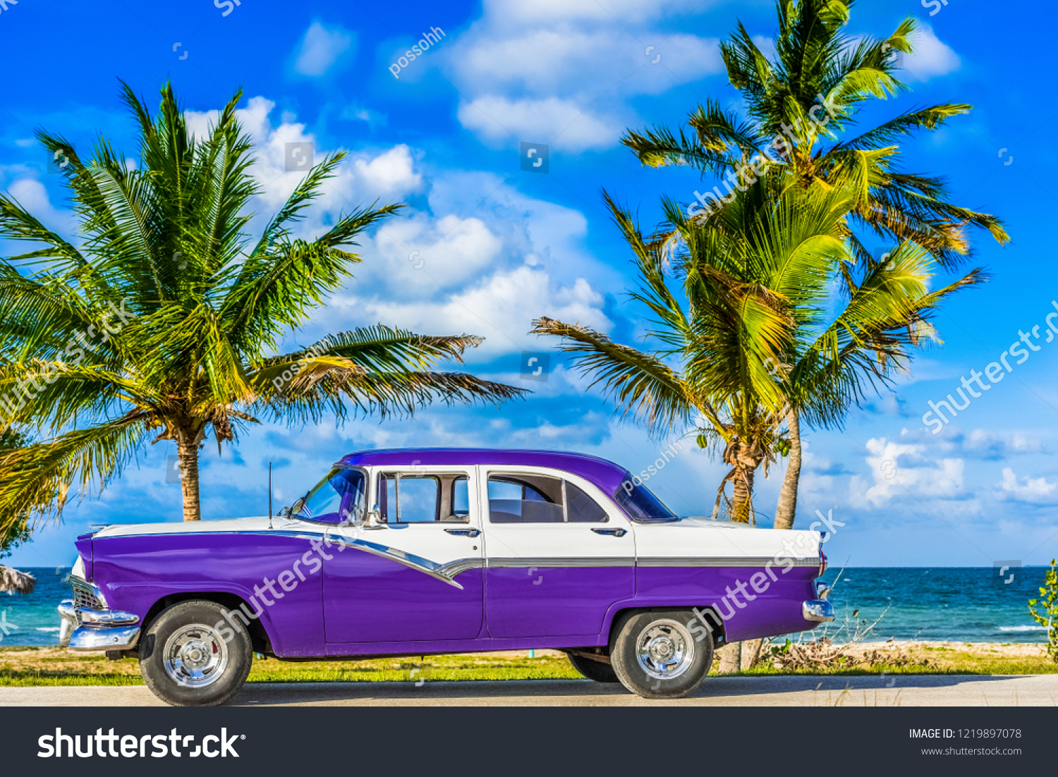 Havana, Cuba - June 30, 2017: HDR - American blue classic car parked on the Malecon near the beach in Havana Cuba - Serie Cuba Reportage #1219897078