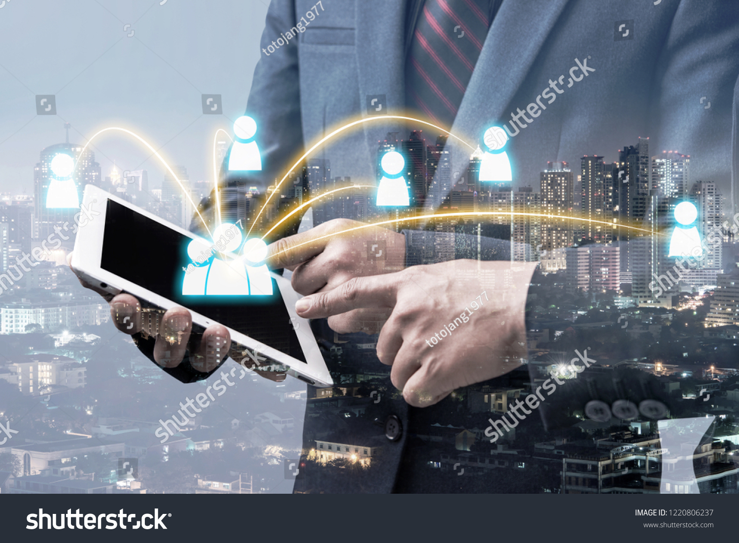 double exposure of businessman using tablet to connect with other people with blur city night background, network business connection concept. #1220806237