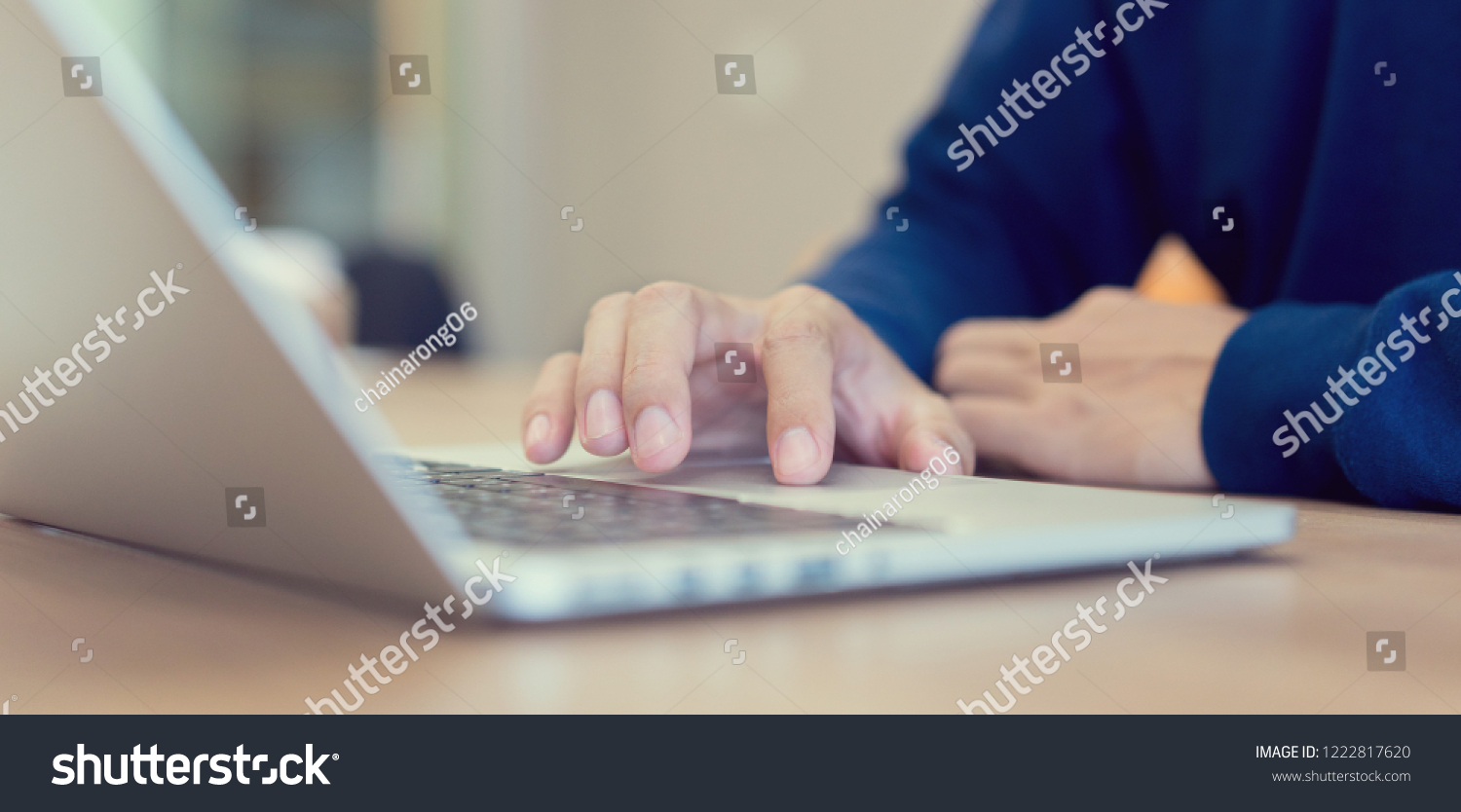 close up freelancer man hand touch on pad bar laptop for searching job or fill out personal data to application form in job website and work from home concept #1222817620